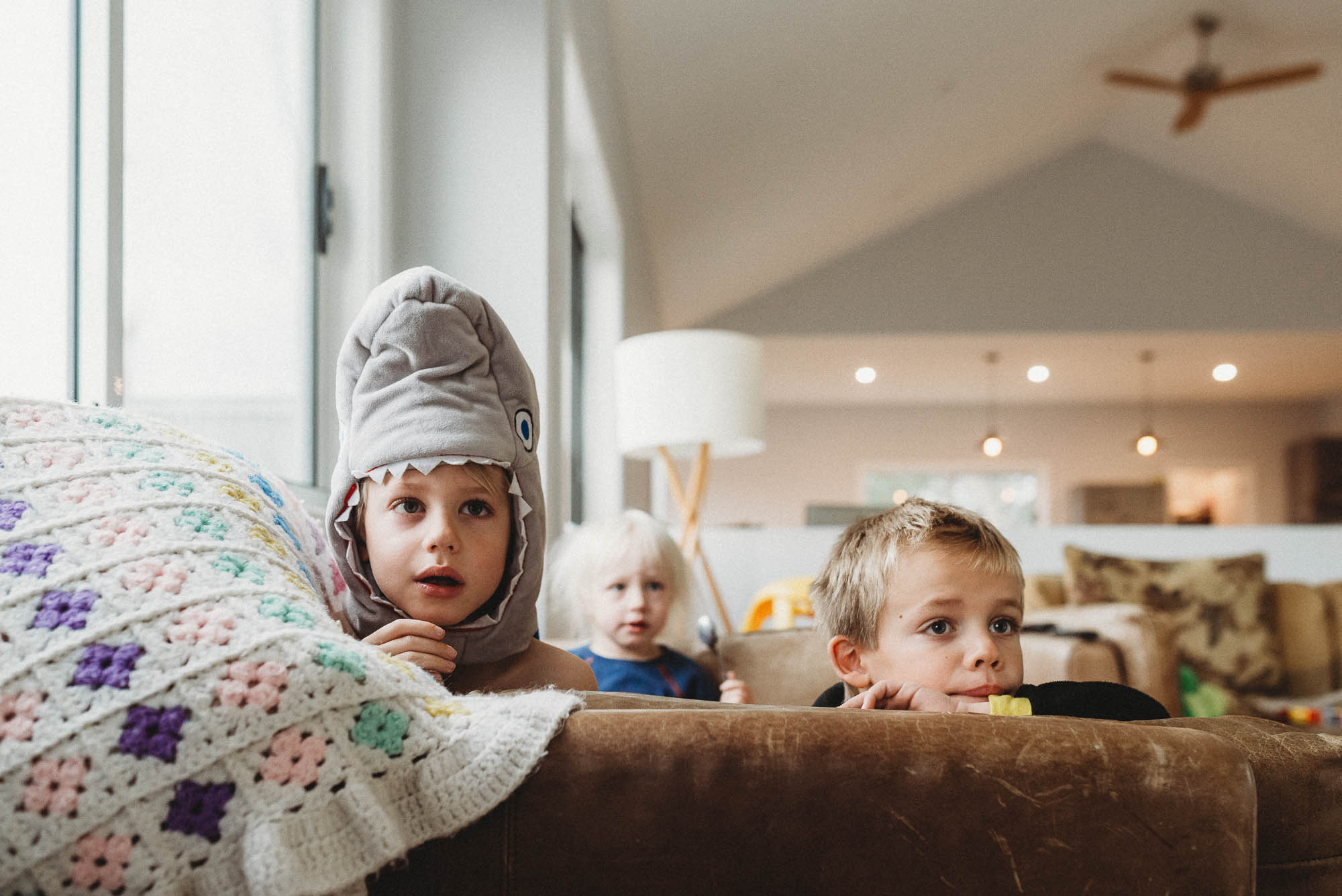 kid with shark hat - documentary family photography