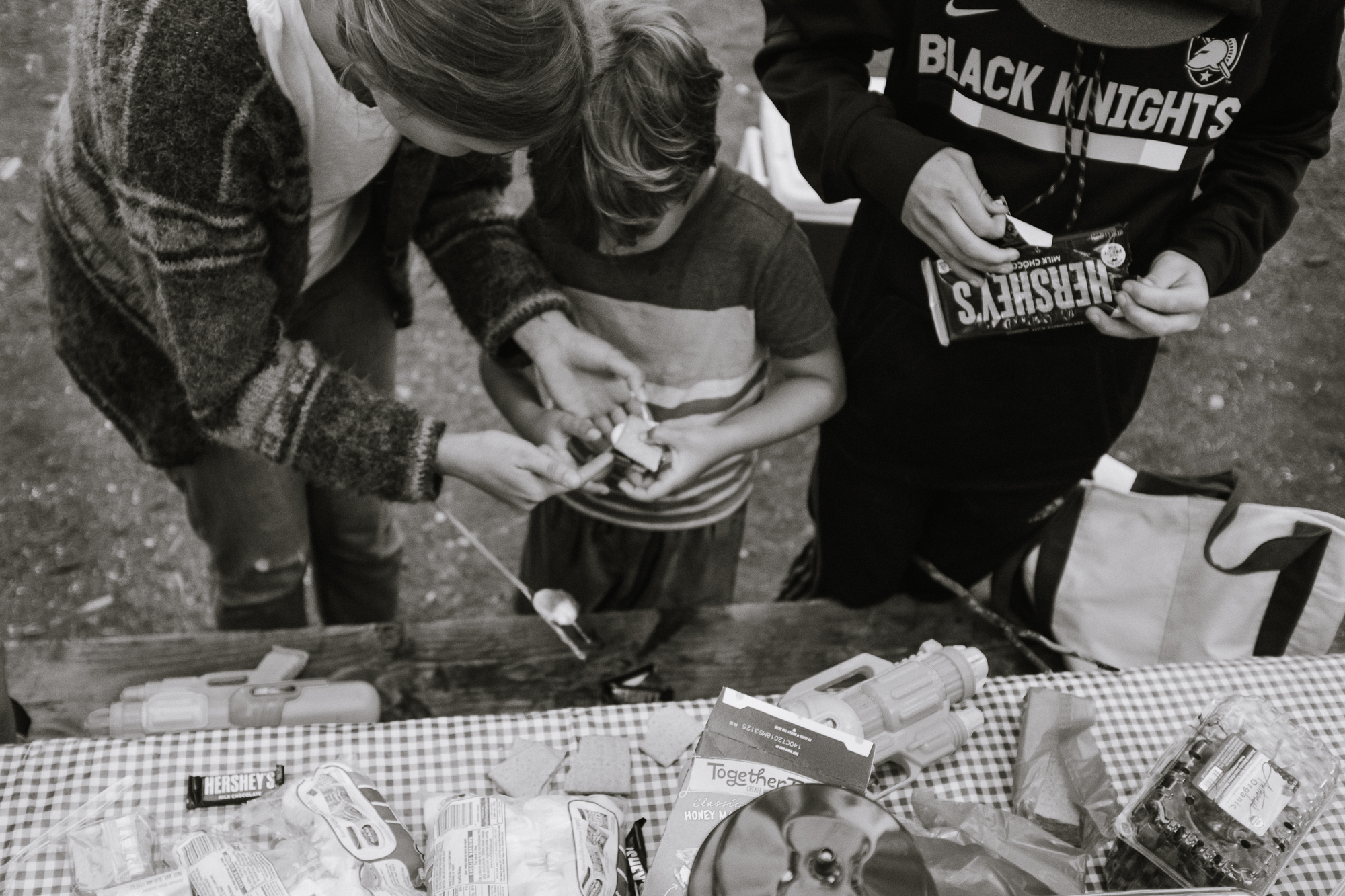 kid making camp food - documentary family photography