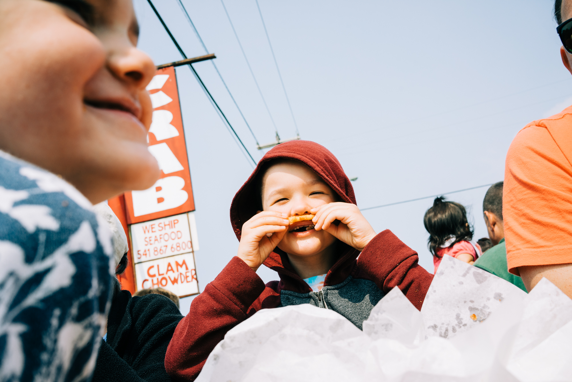 kid makes mustache with food - documentary family photography