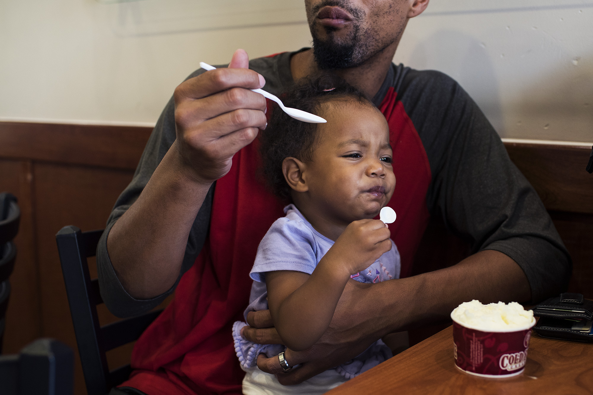 father eating ice cream with baby - documentary family photography