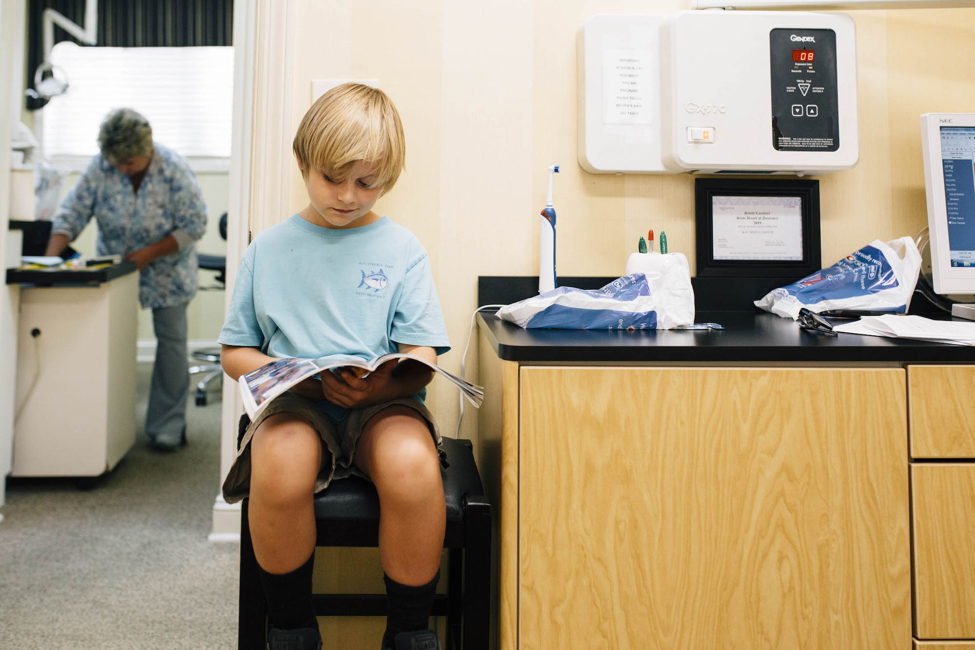 boy waiting in Dr office - documentary family photography