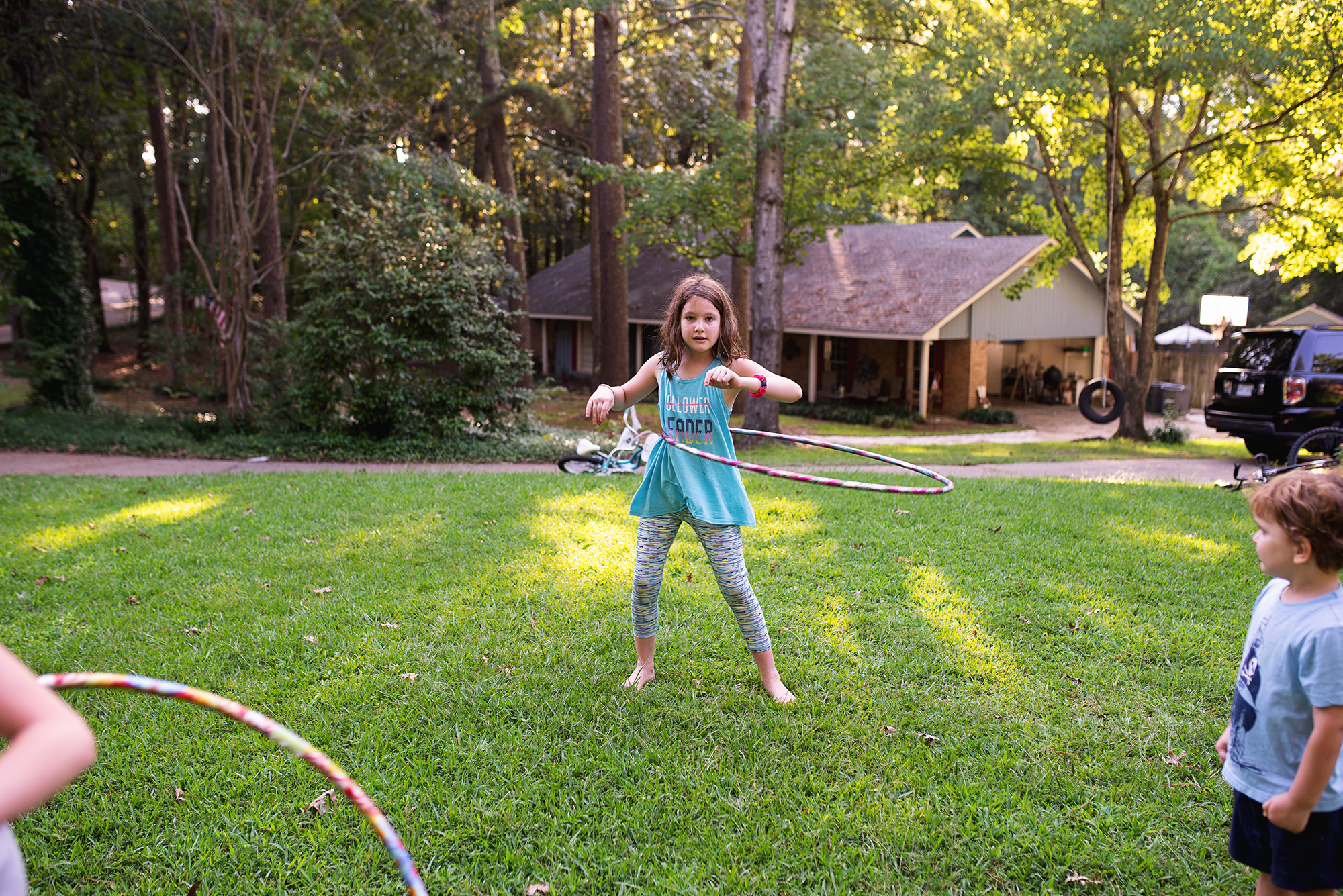 girl with hula hoop - documentary family photography