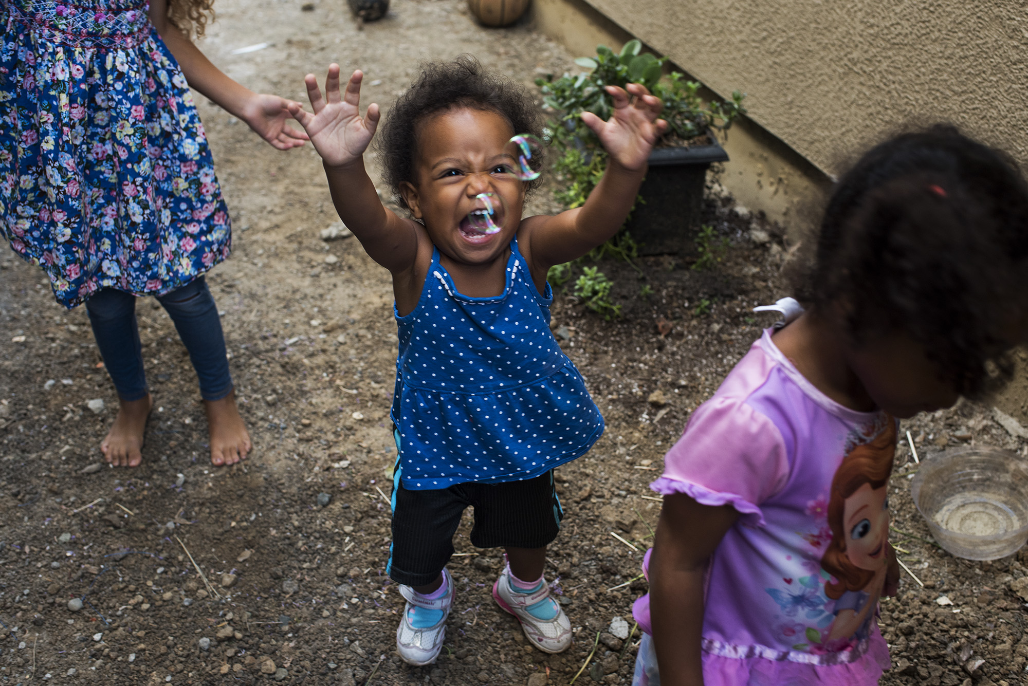 toddler with bubbles - documentary family photography