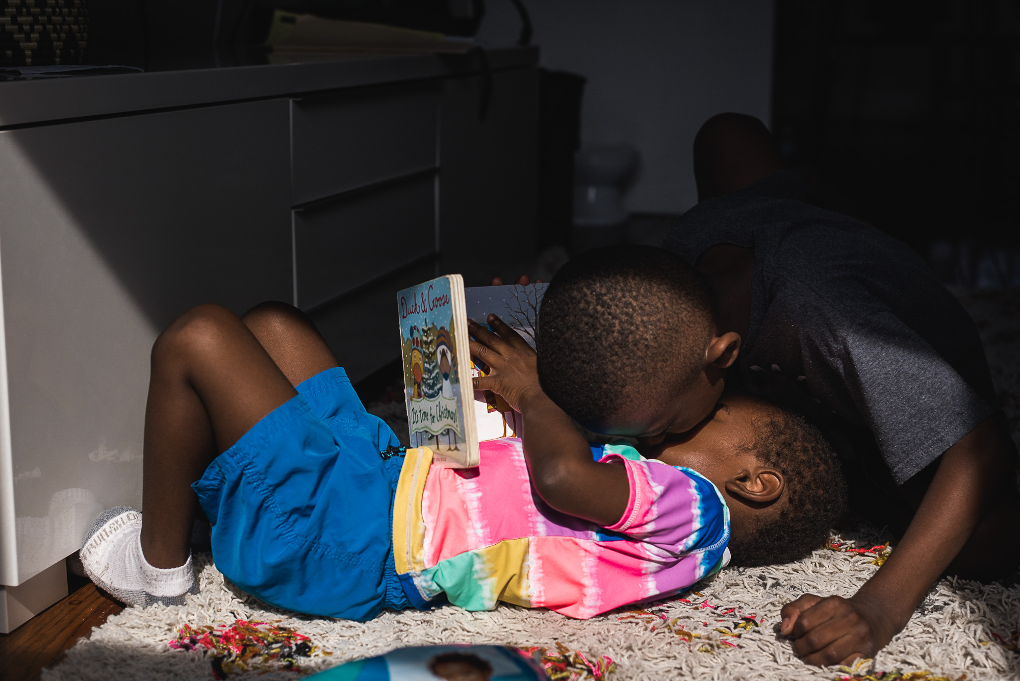 brothers with book - documentary family photography