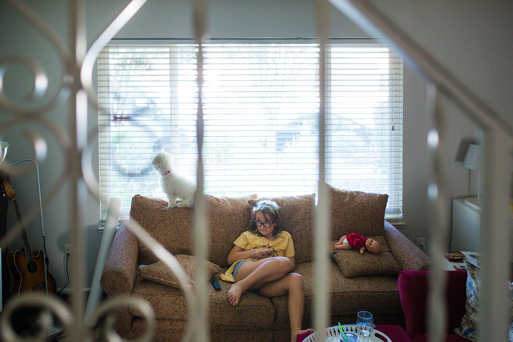 girl sitting on couch - documentary family photography