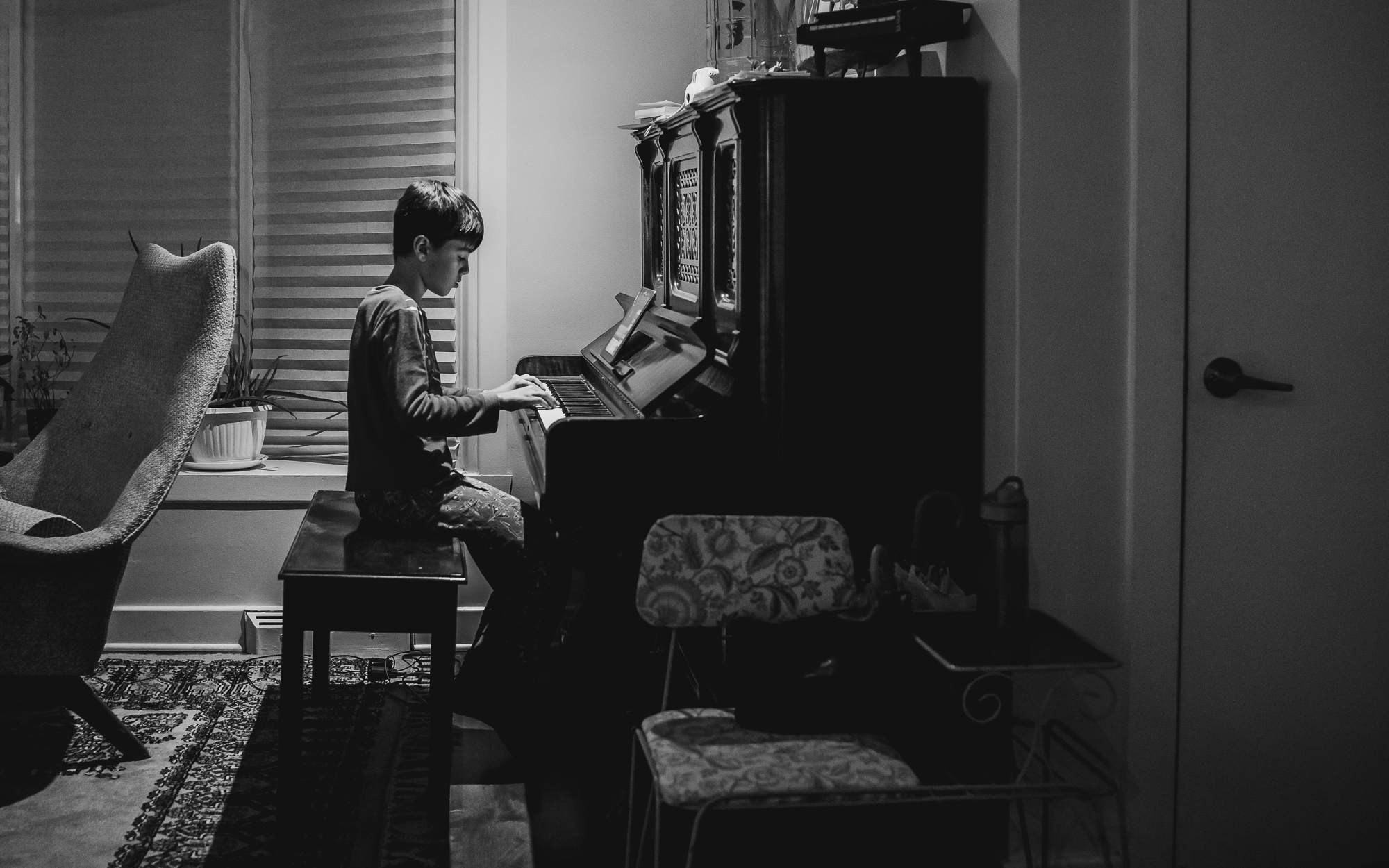 boy at piano - documentary family photography