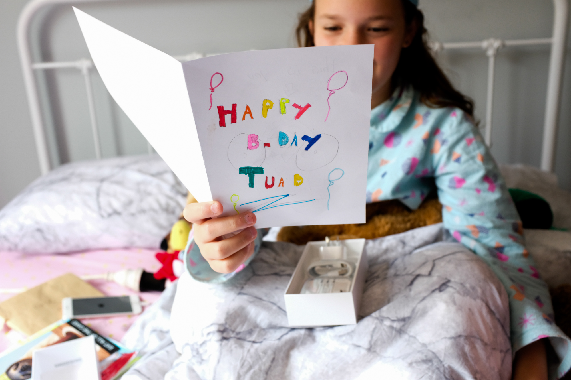 girl with homemade birthday card - documentary family photography