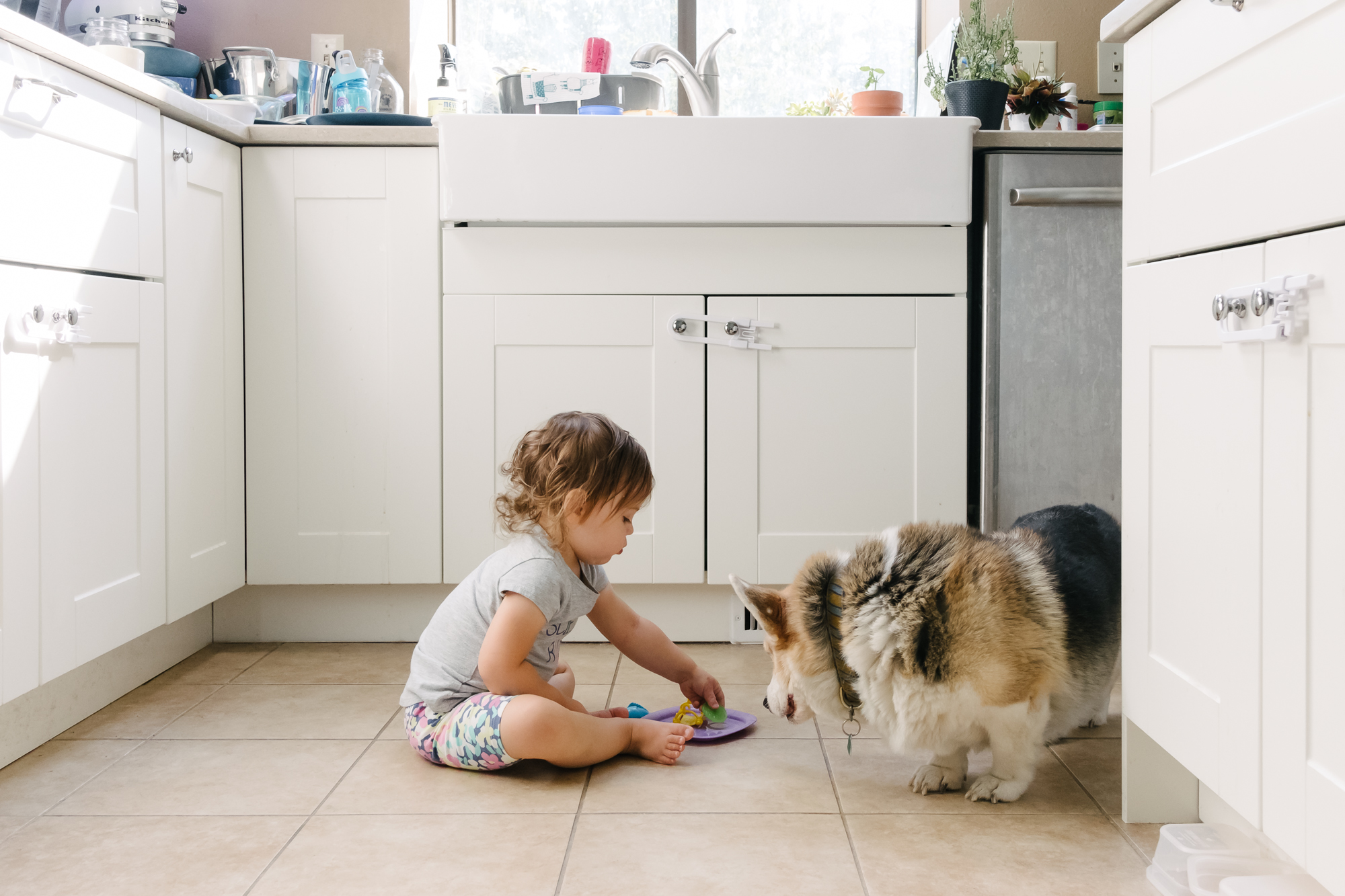 girl with toys and dog - documentary family photography