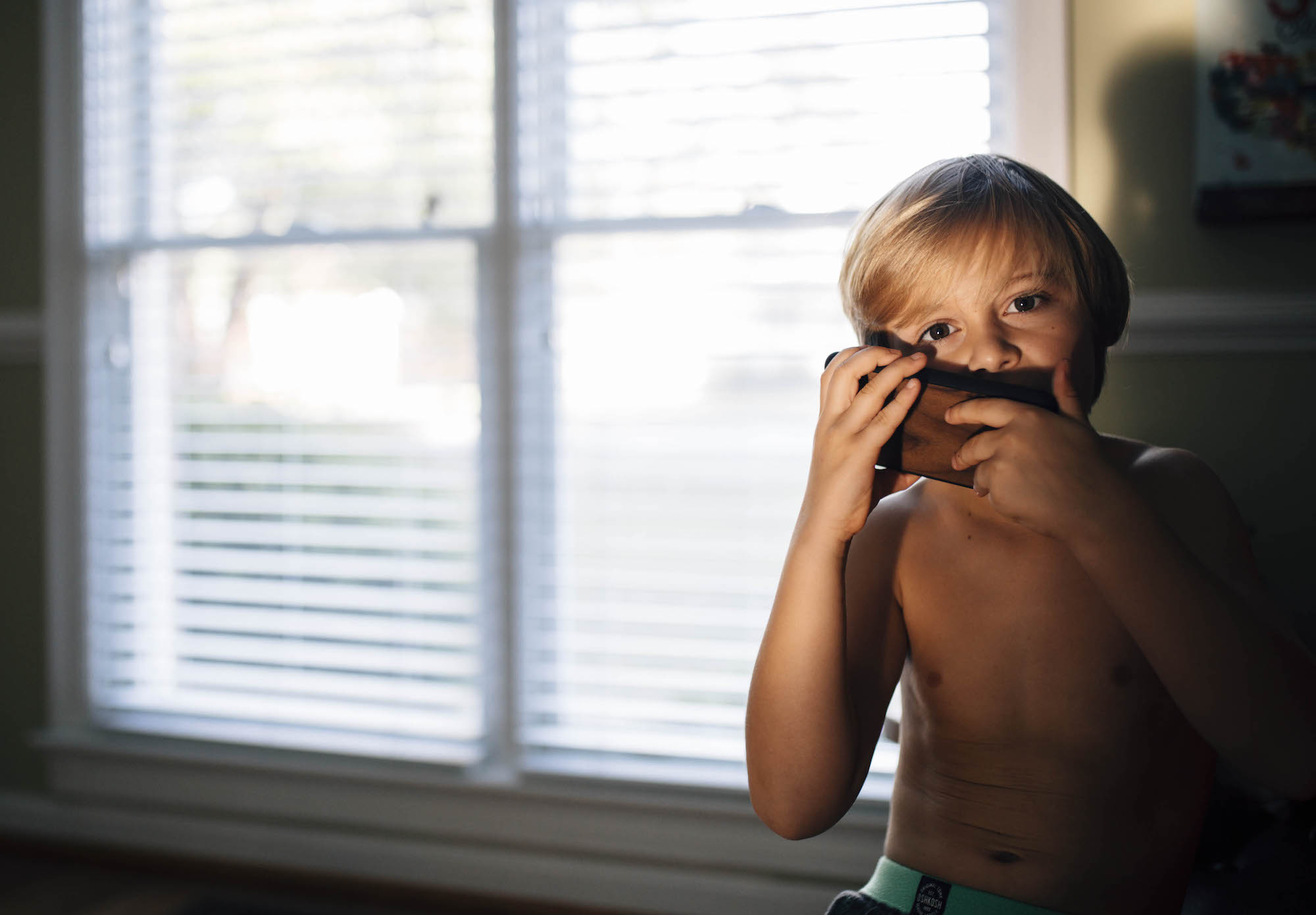 boy in afternoon light - documentary family photography