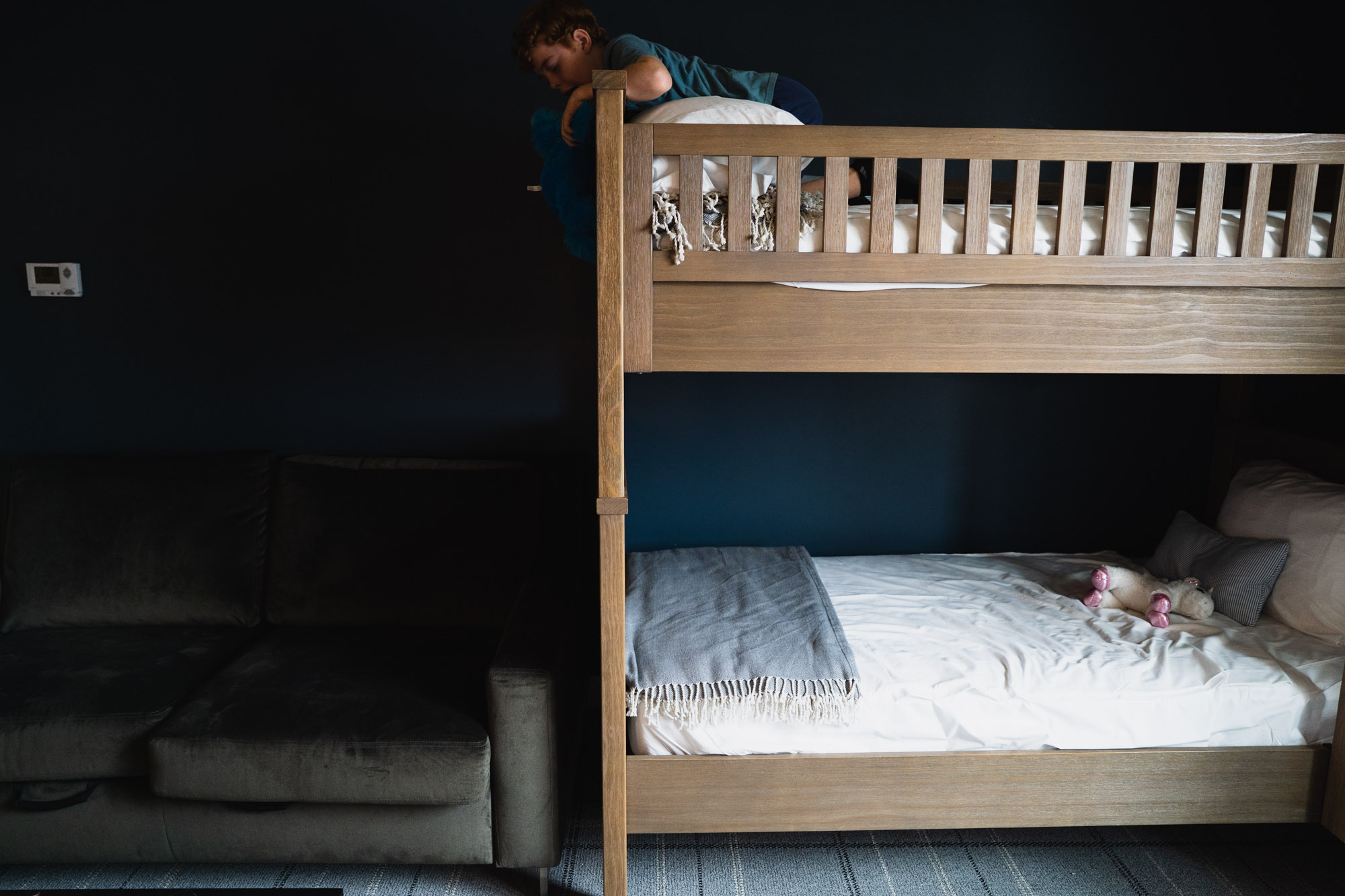 boy on bunk beds - documentary family photography