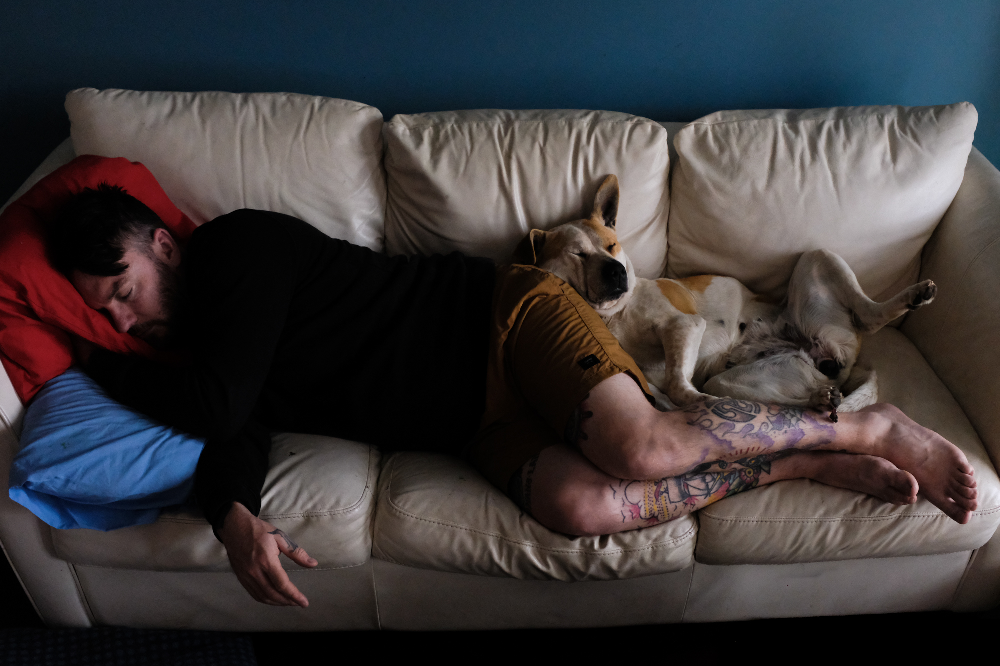 man asleep on couch - documentary family photography