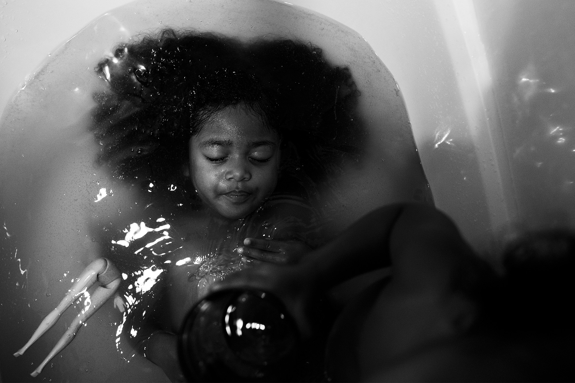 girl in tub - documentary family photography