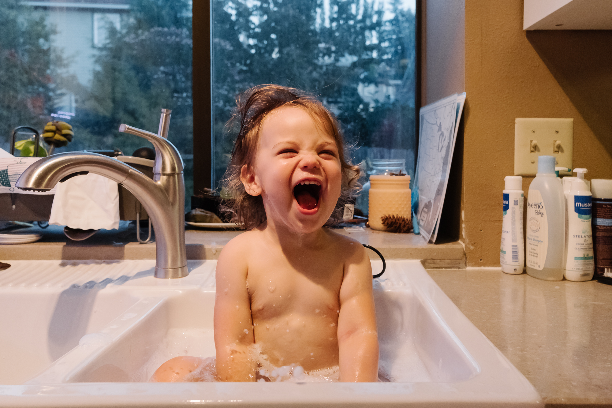 girl in sink bath - documentary family photography