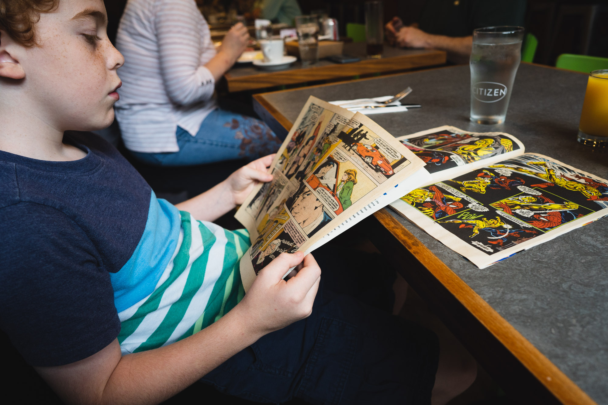 boy reading comics - documentary family photography