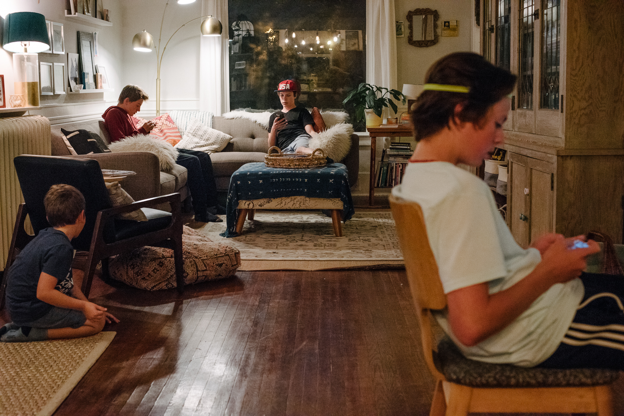 family in living room during evening - documentary family photography