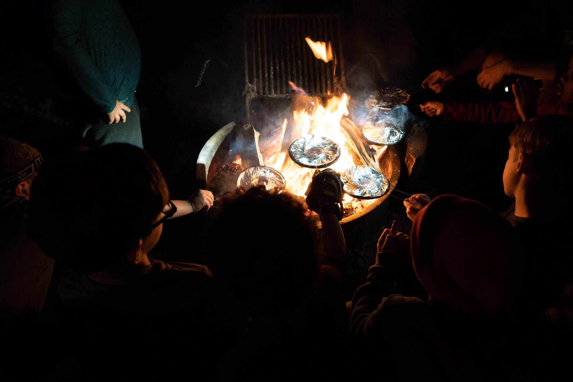 making popcorn at fire pit - documentary family photography