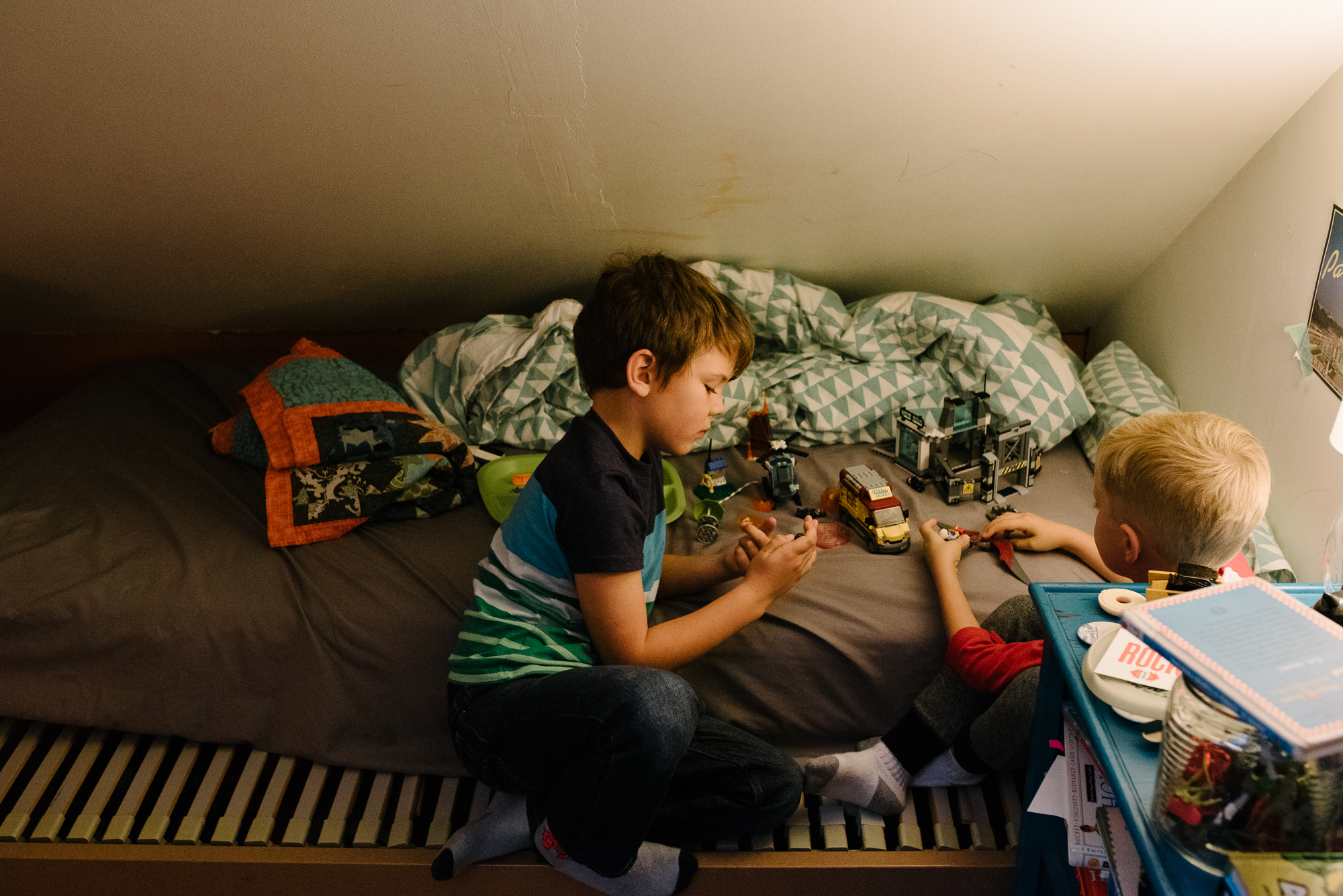 boys play with trucks on floor - documentary family photography