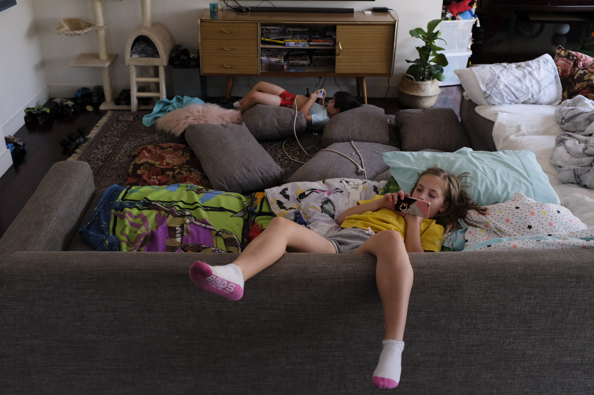 kids lounging on couch - documentary family photography