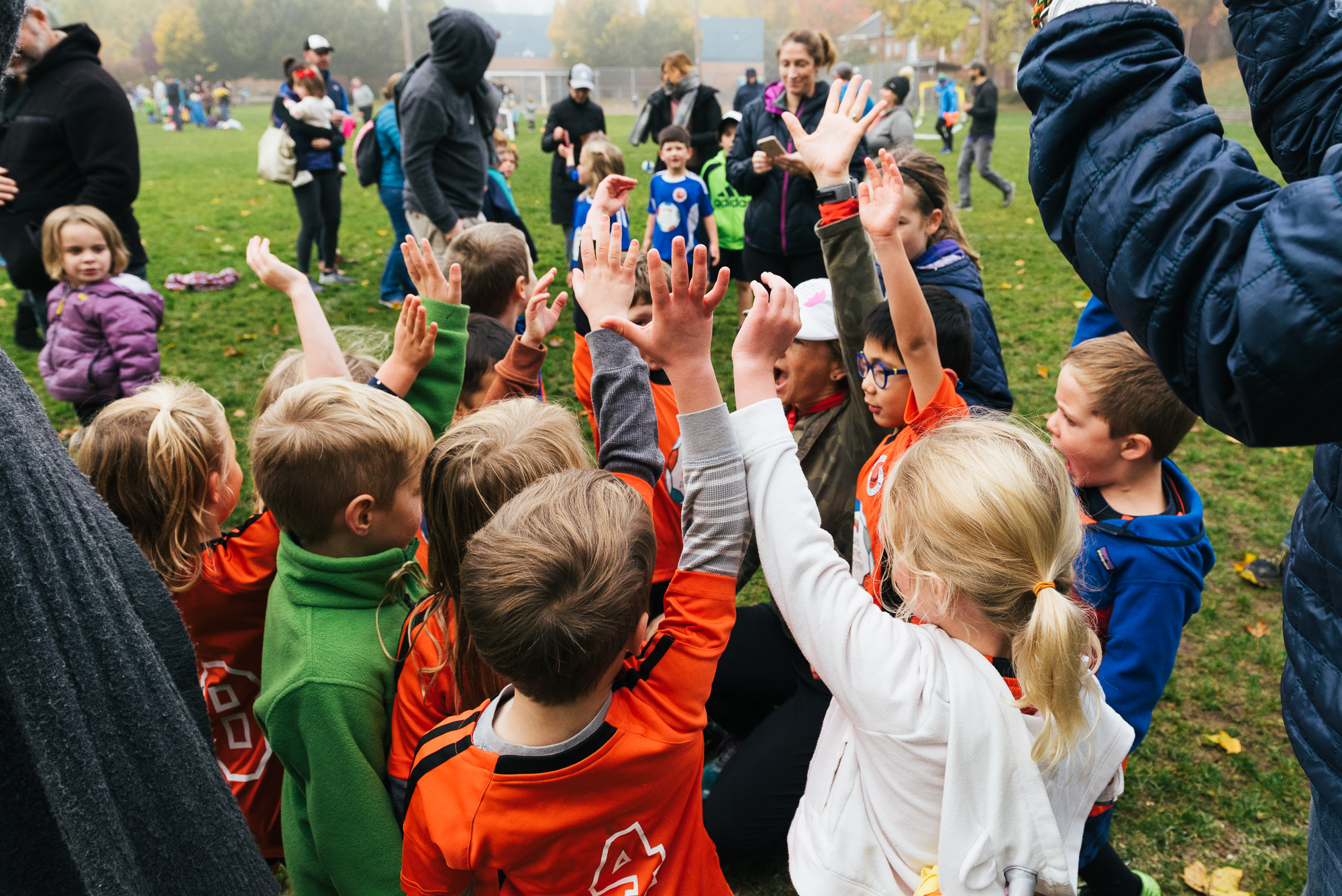 kids raising hands - documentary family photography