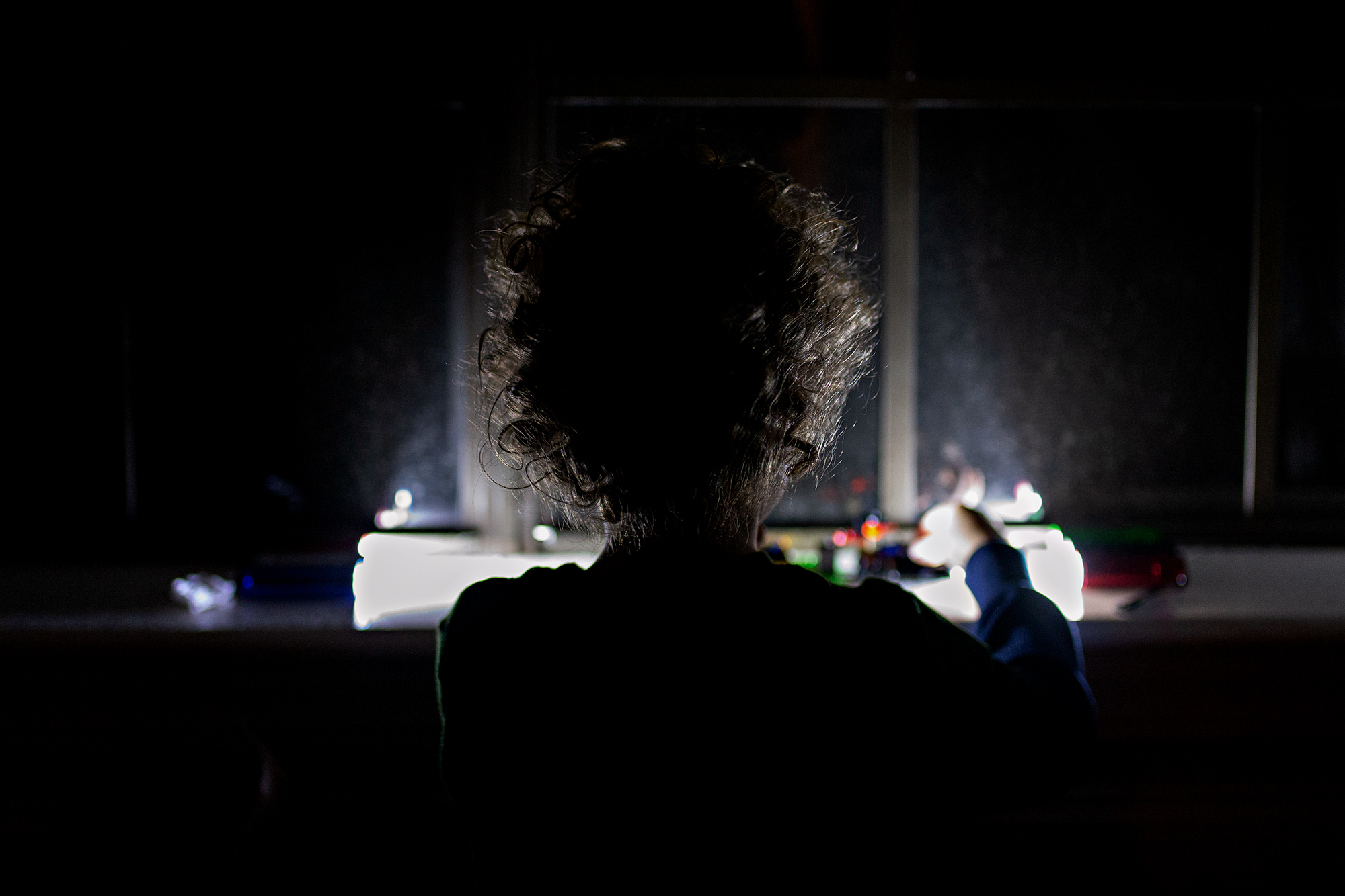 child's backlit curly hair - documentary family photography