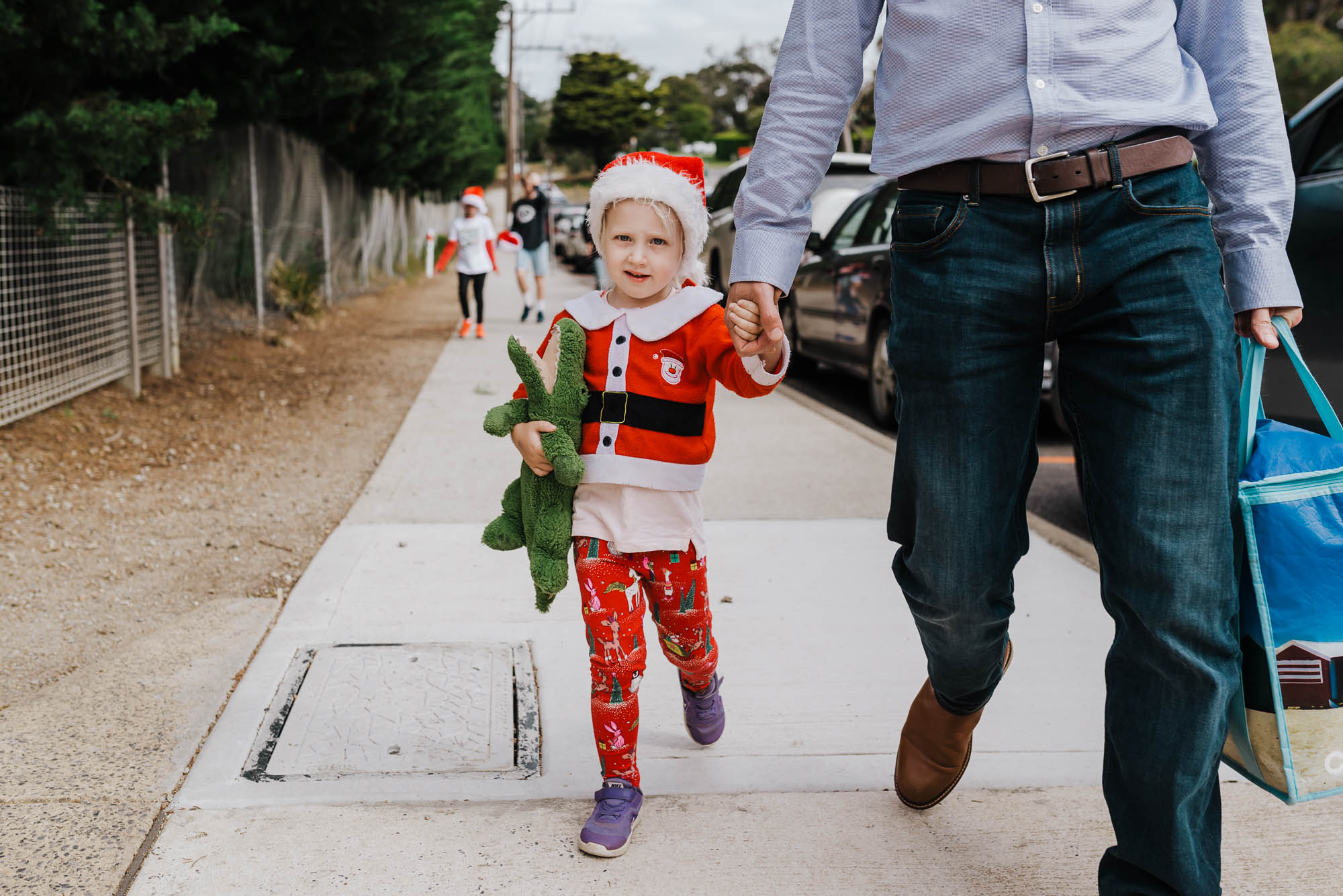 child in santa PJs - documentary family photography