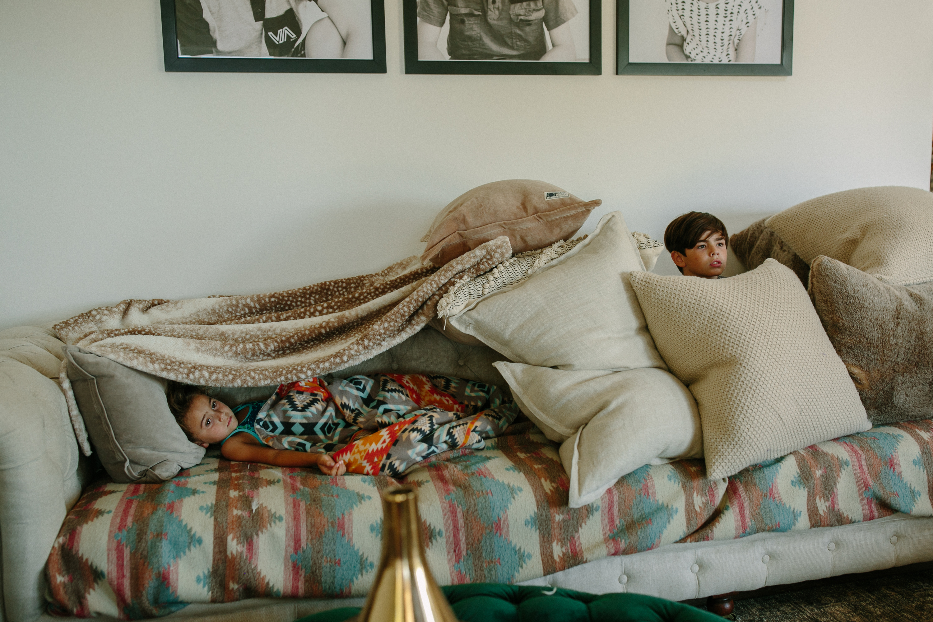 kids in pillows and blankets - documentary family photography