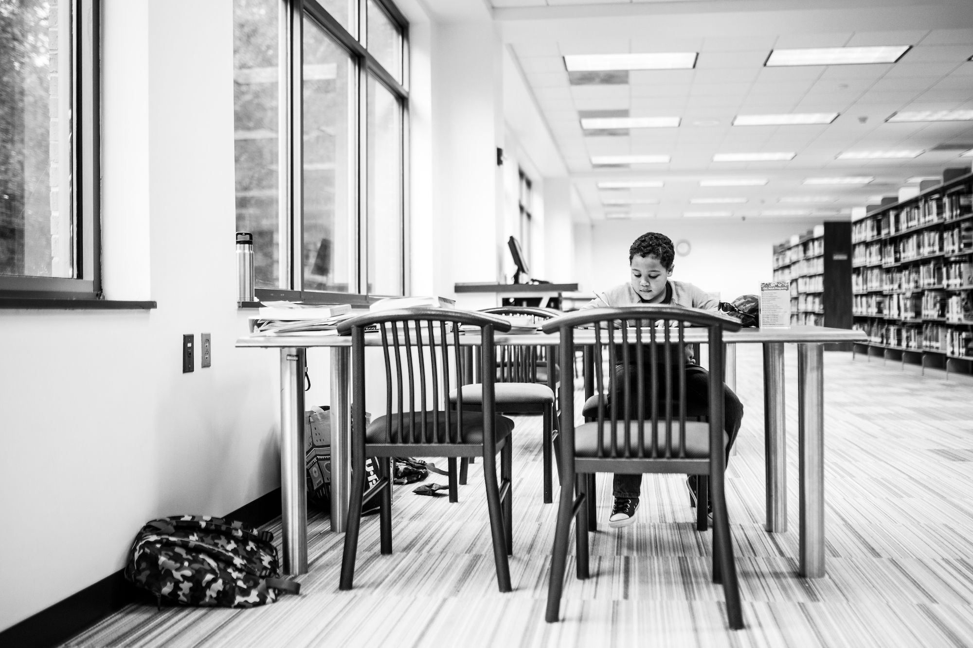 boy working at table - documentary family photography