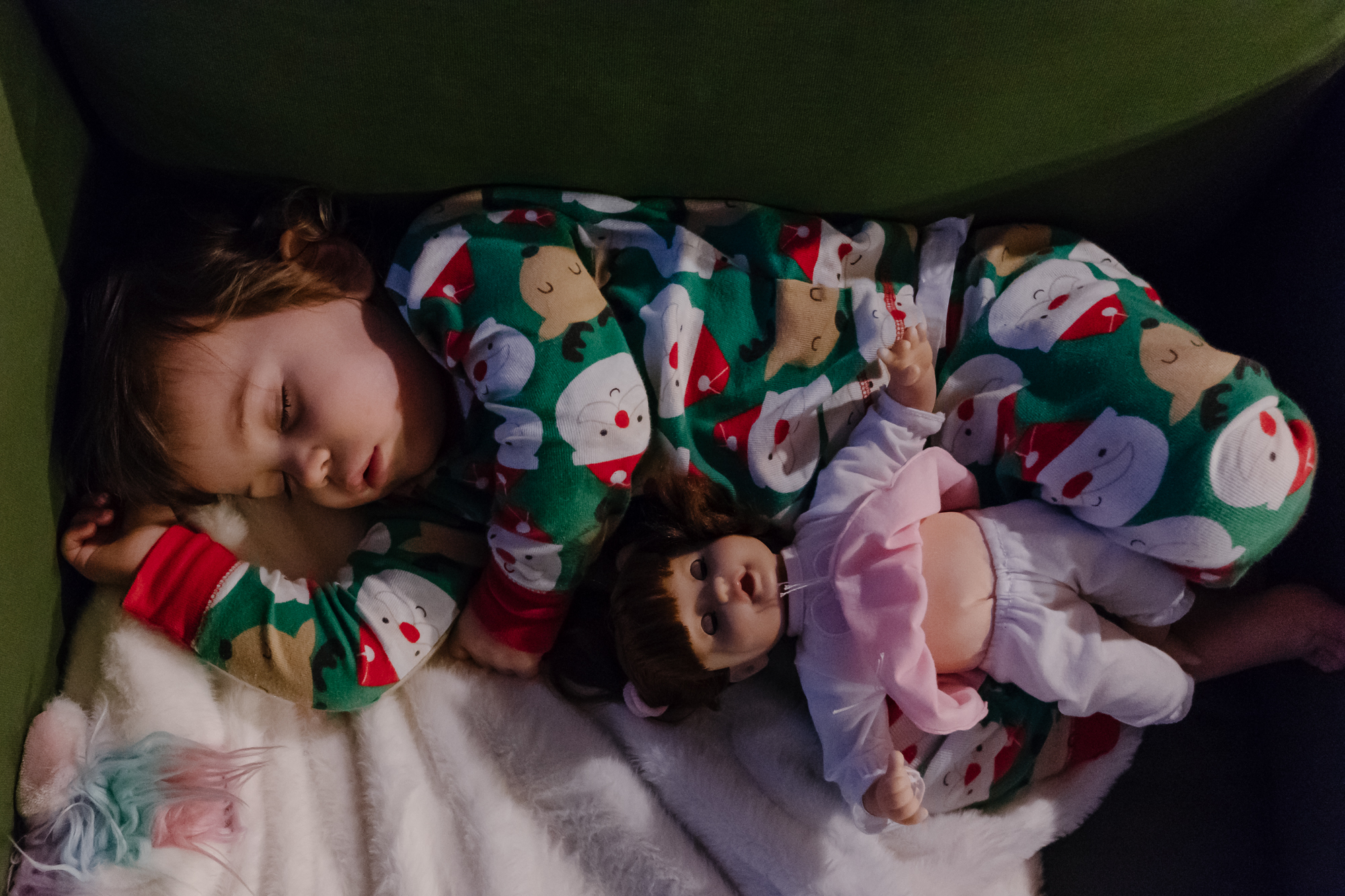 girl asleep with doll - documentary family photography