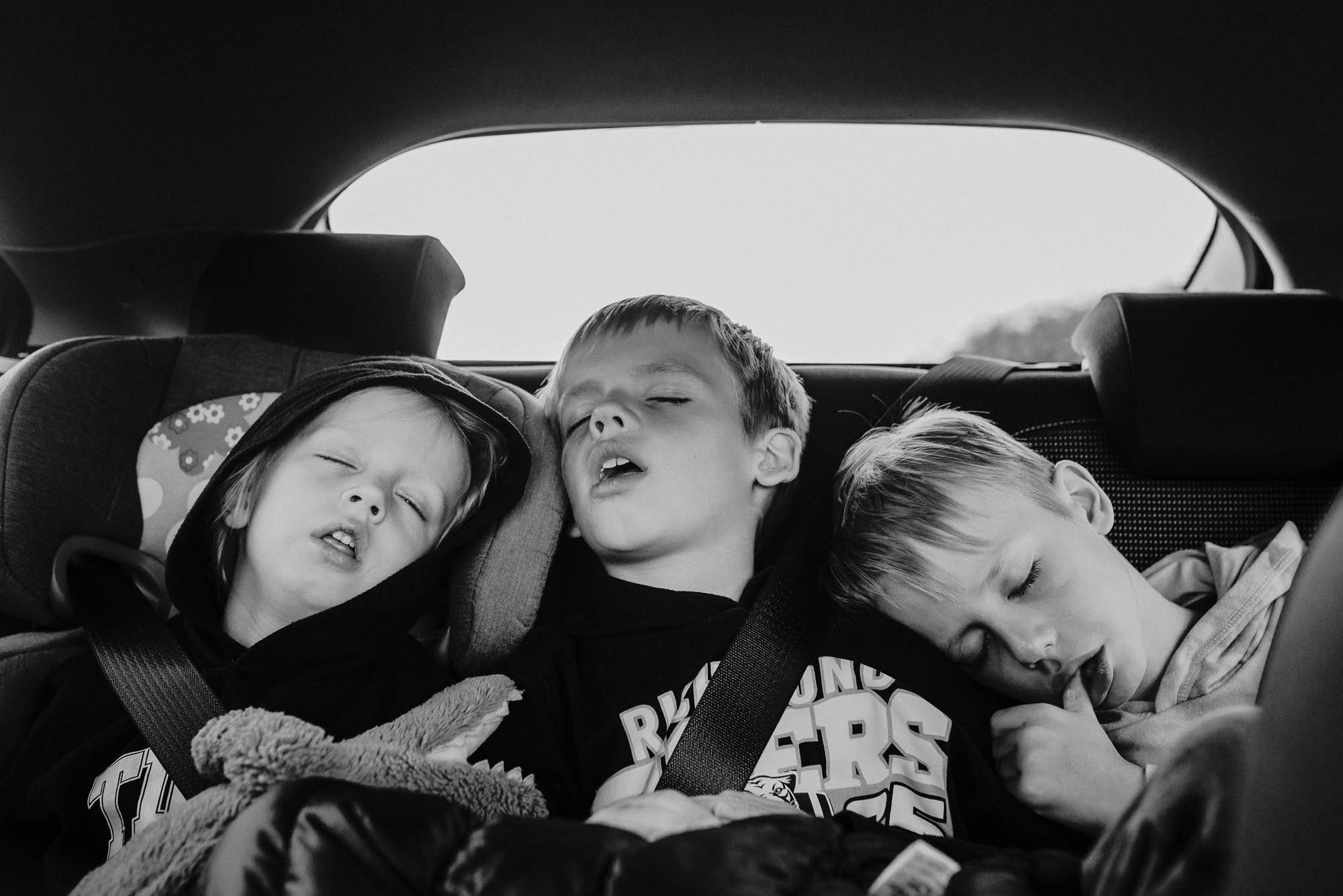 kids asleep in car - documentary family photography