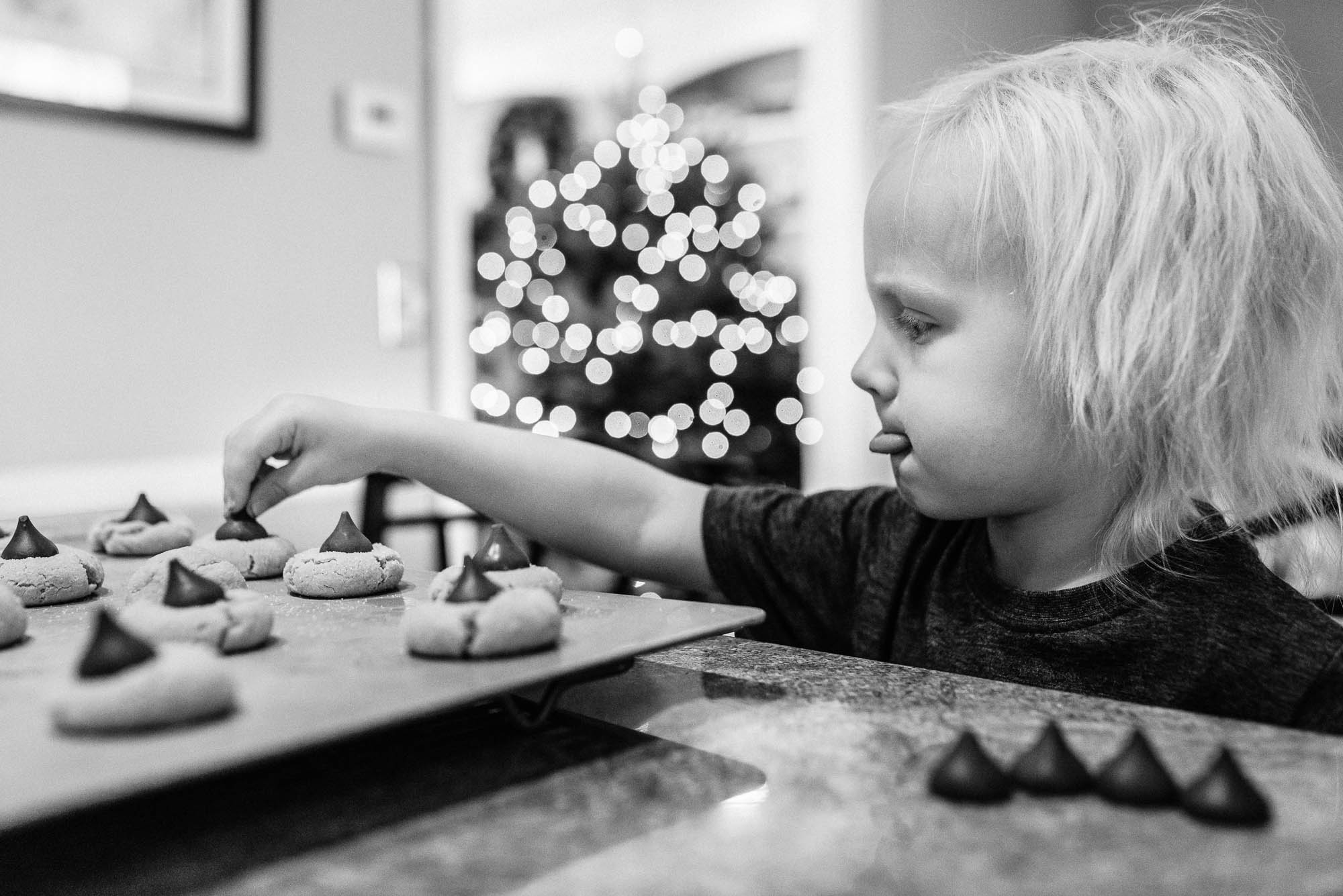 child helps make cookies - documentary family photography