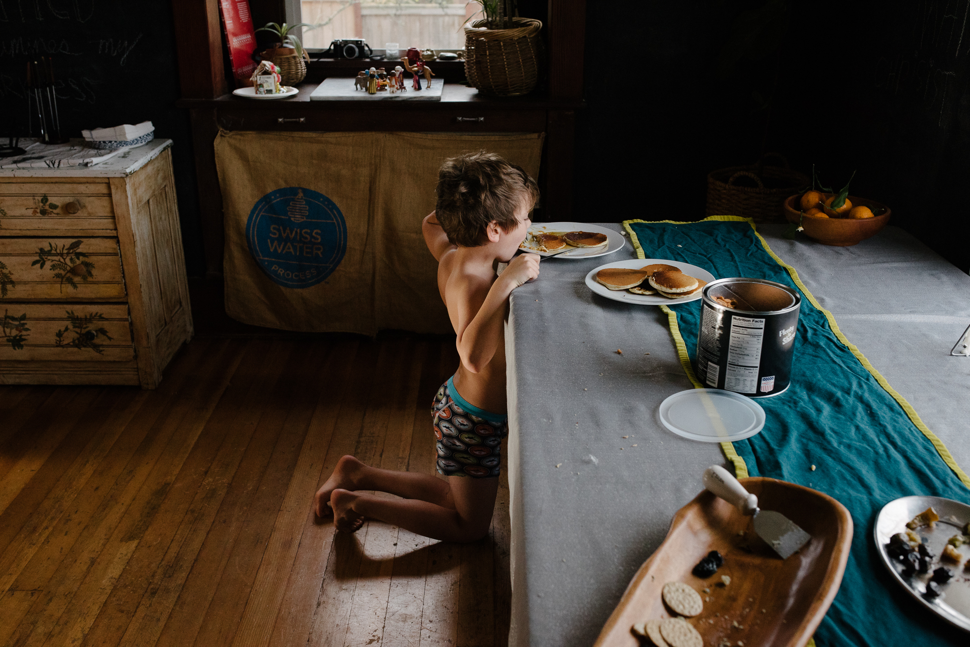 boy at table with pancakes- documentary family photography