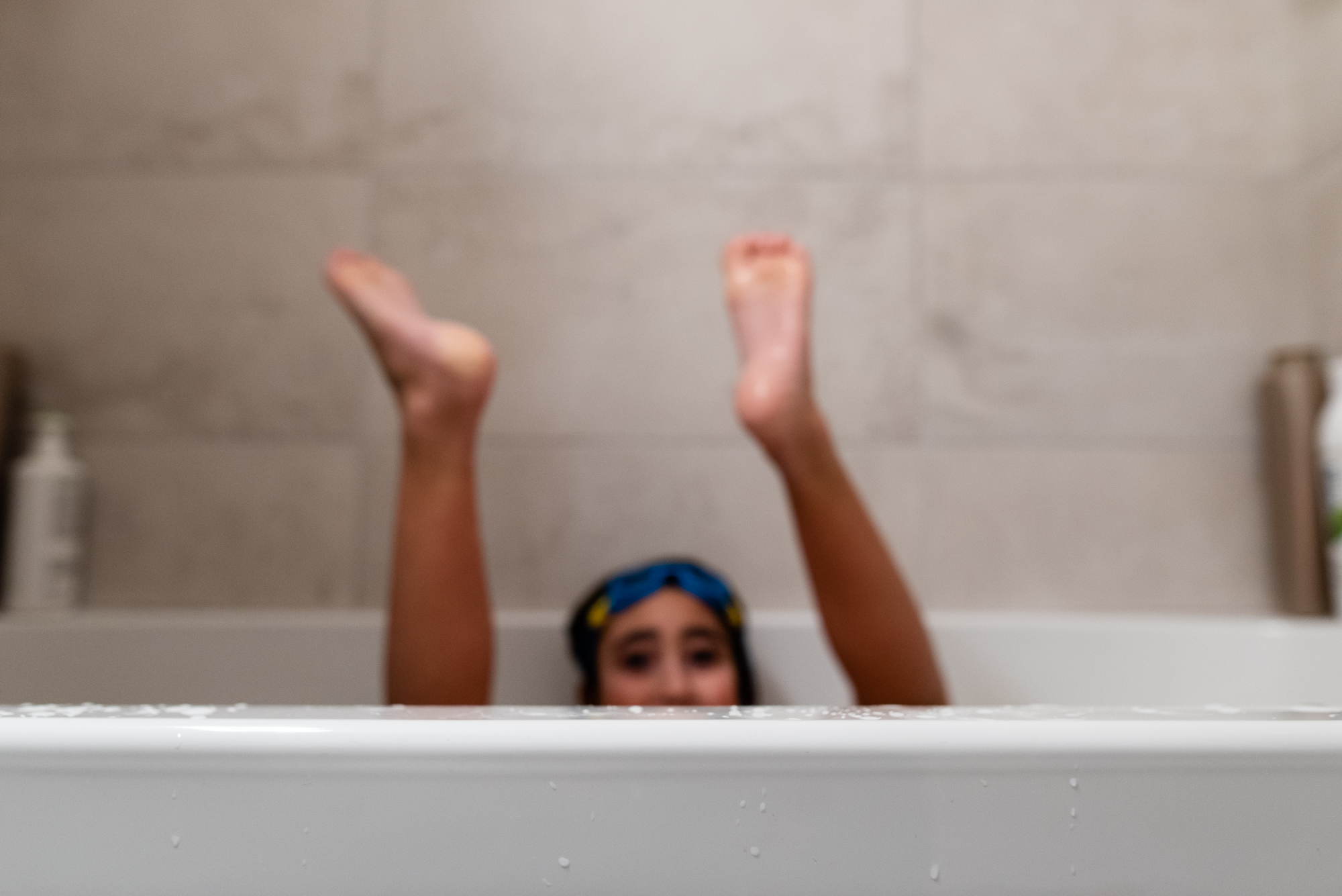 kid feet in tub - documentary family photography