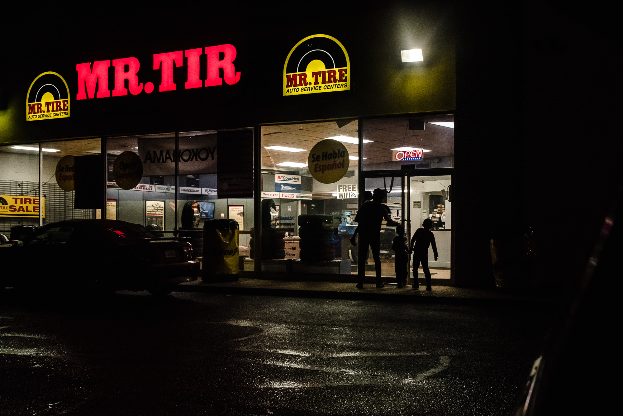 kids in parking lot at night - documentary family photography