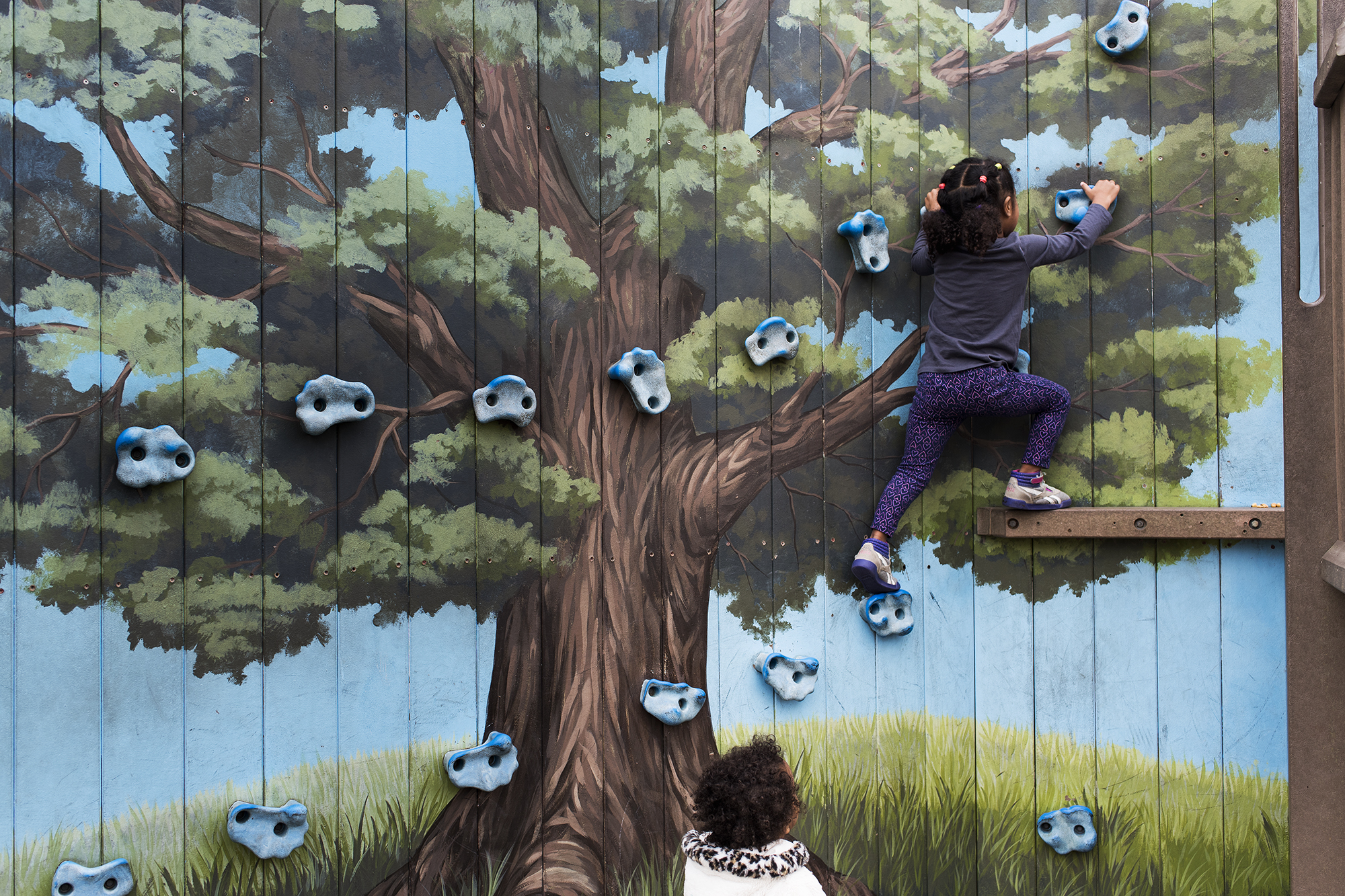 kids on climbing wall - documentary family photography