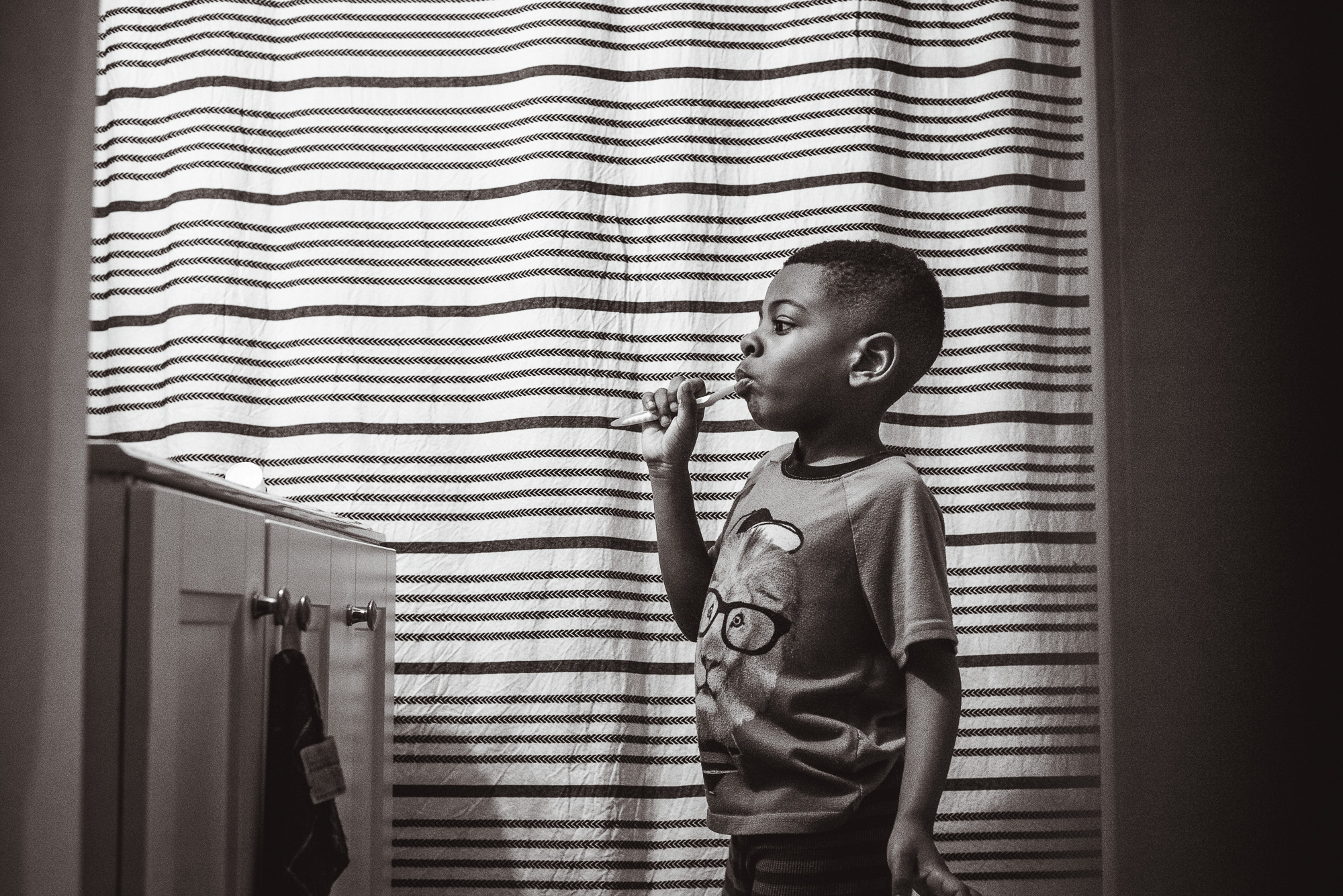 boy brushing teeth - documentary family photography