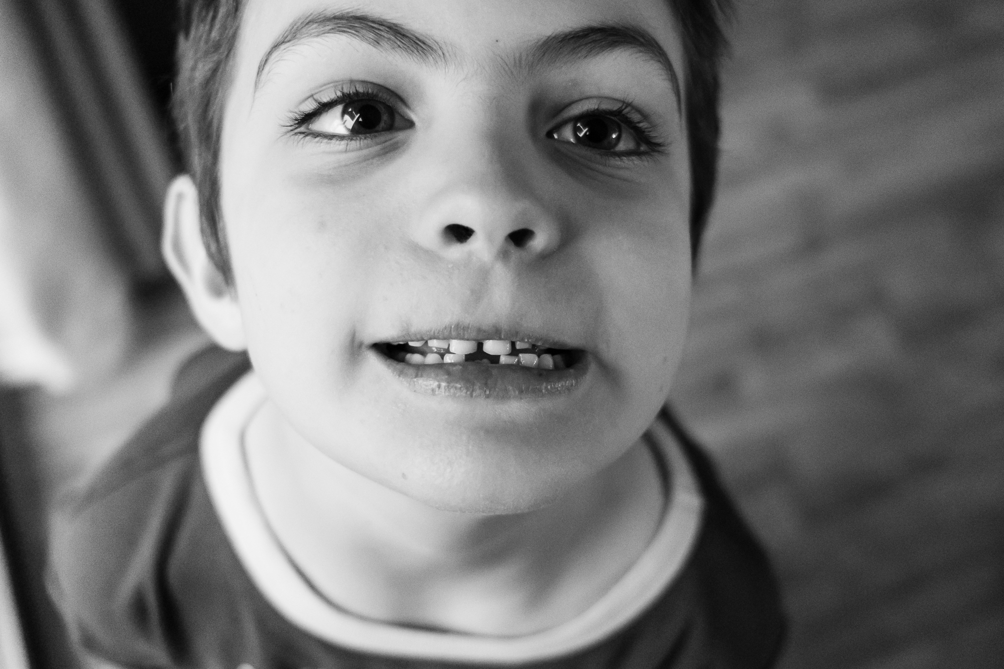 boy with missing tooth - documentary family photography