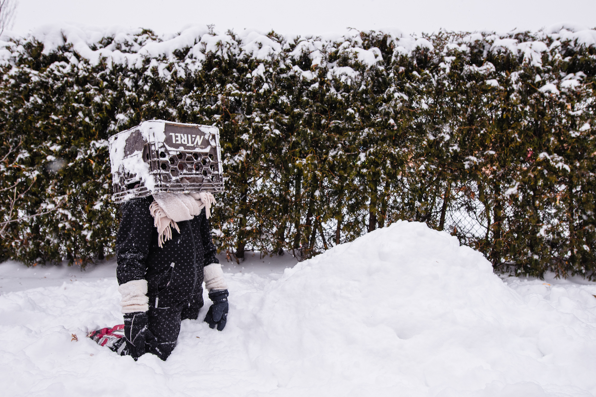 kid playing in the snow - documentary family photography