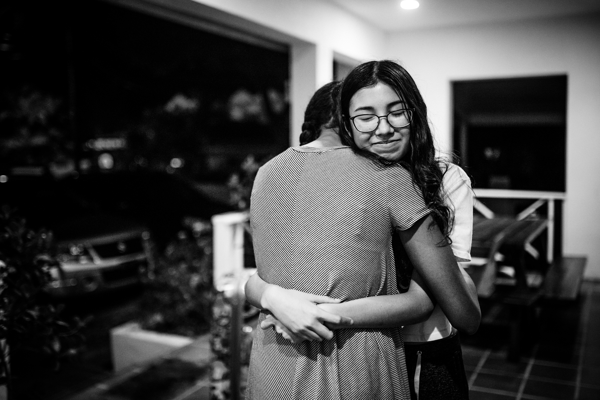 friends hugging - documentary family photography