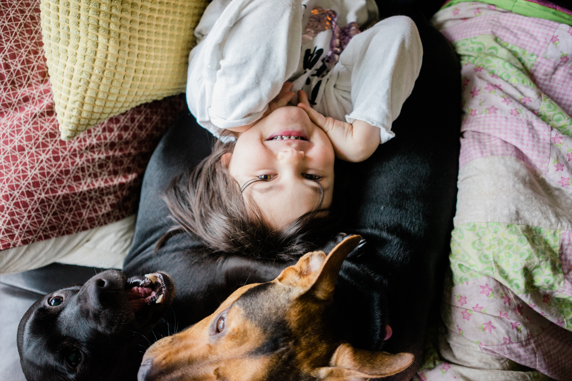 girl snuggling with dog -documentary family photography