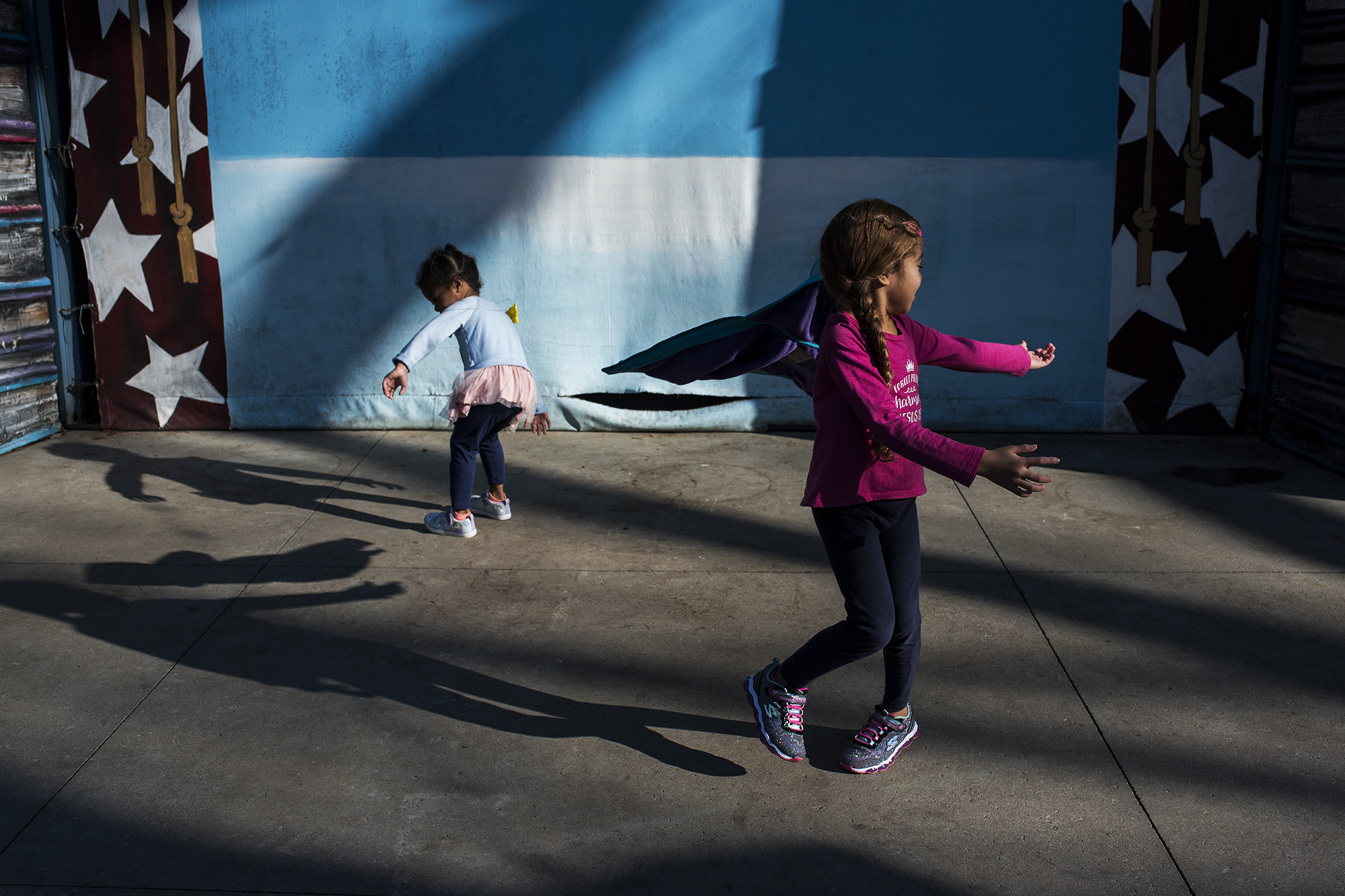 kids spinning in sunlight - documentary family photography