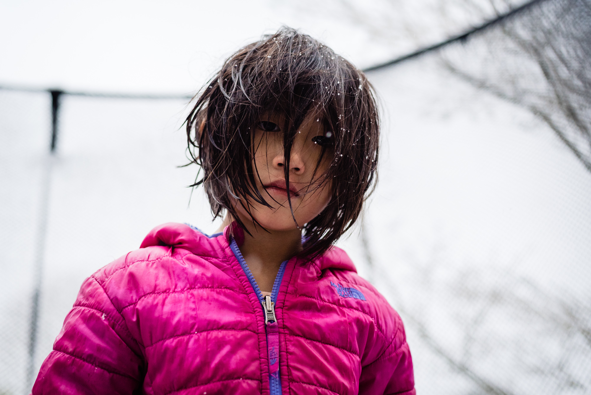 girl with snow in hair - documentary family photography