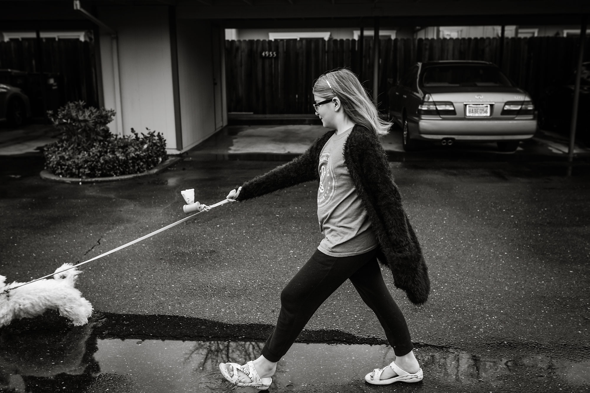 girl walking dog - documentary family photography