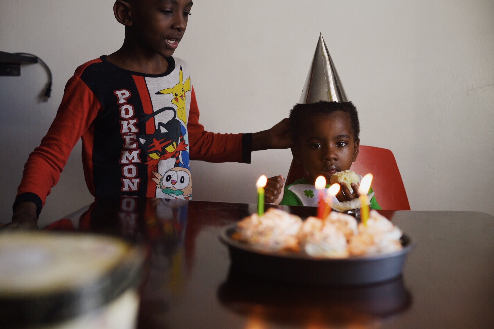 boy with birthday cake - documentary family photography