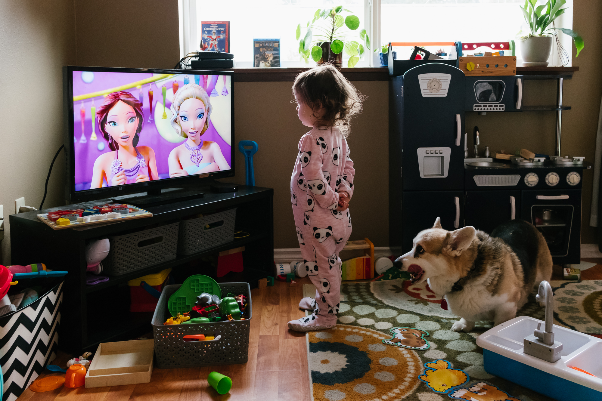 girl watching TV in Pajamas - documentary family photography