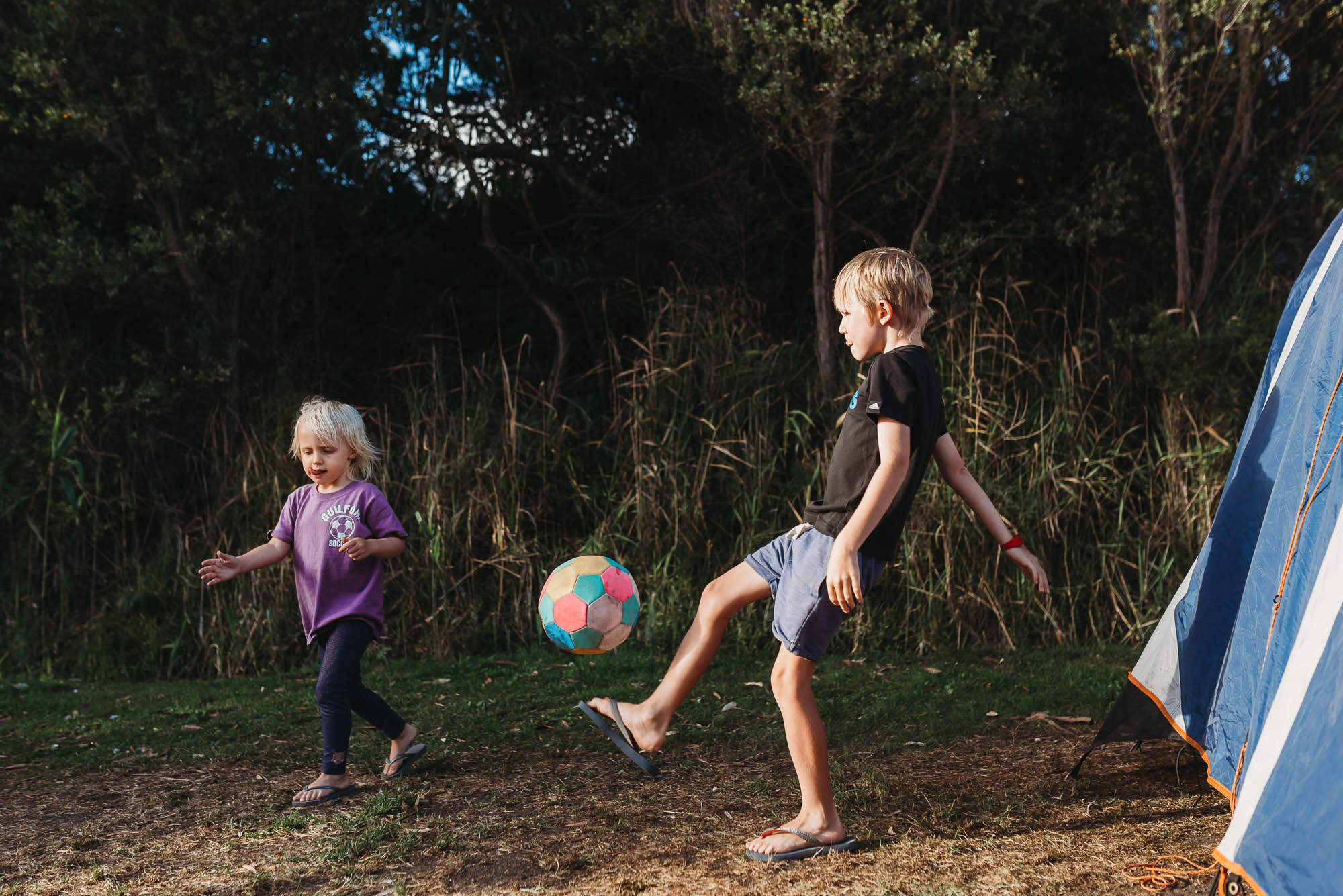 boy kicking ball - documentary family photography