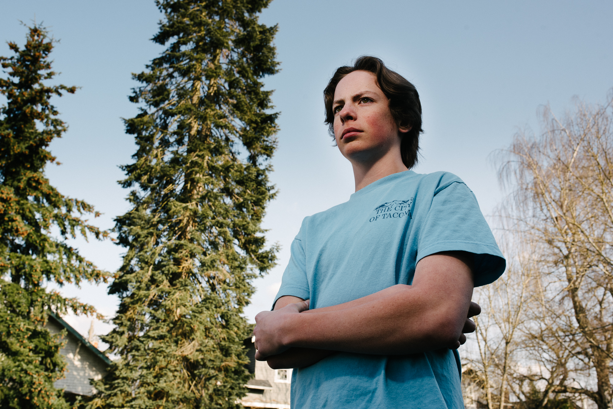 boy with arms crossed - documentary family photography