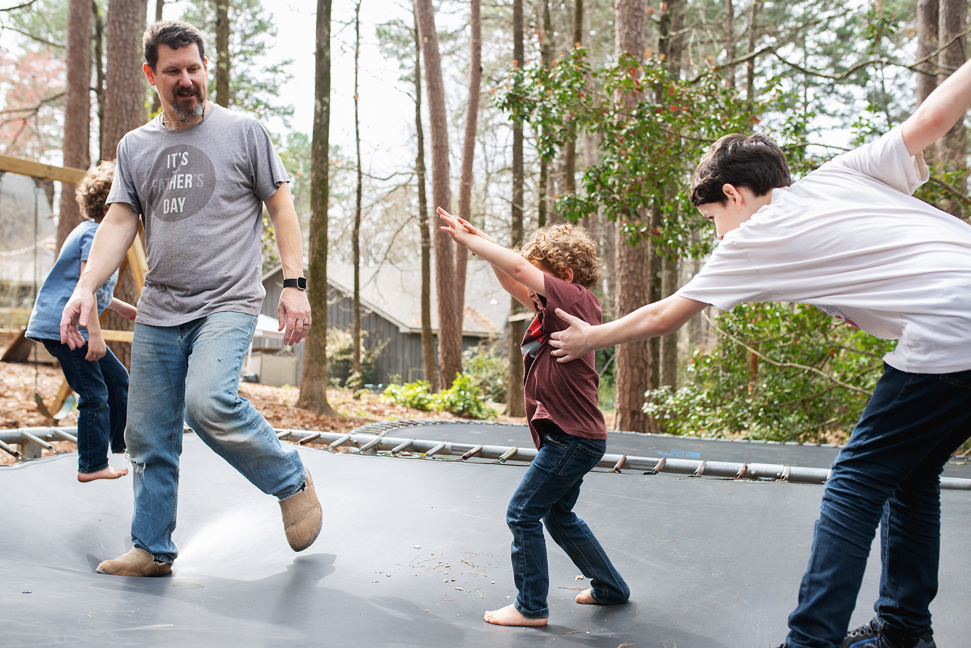 family on trampoline - documentary family photography