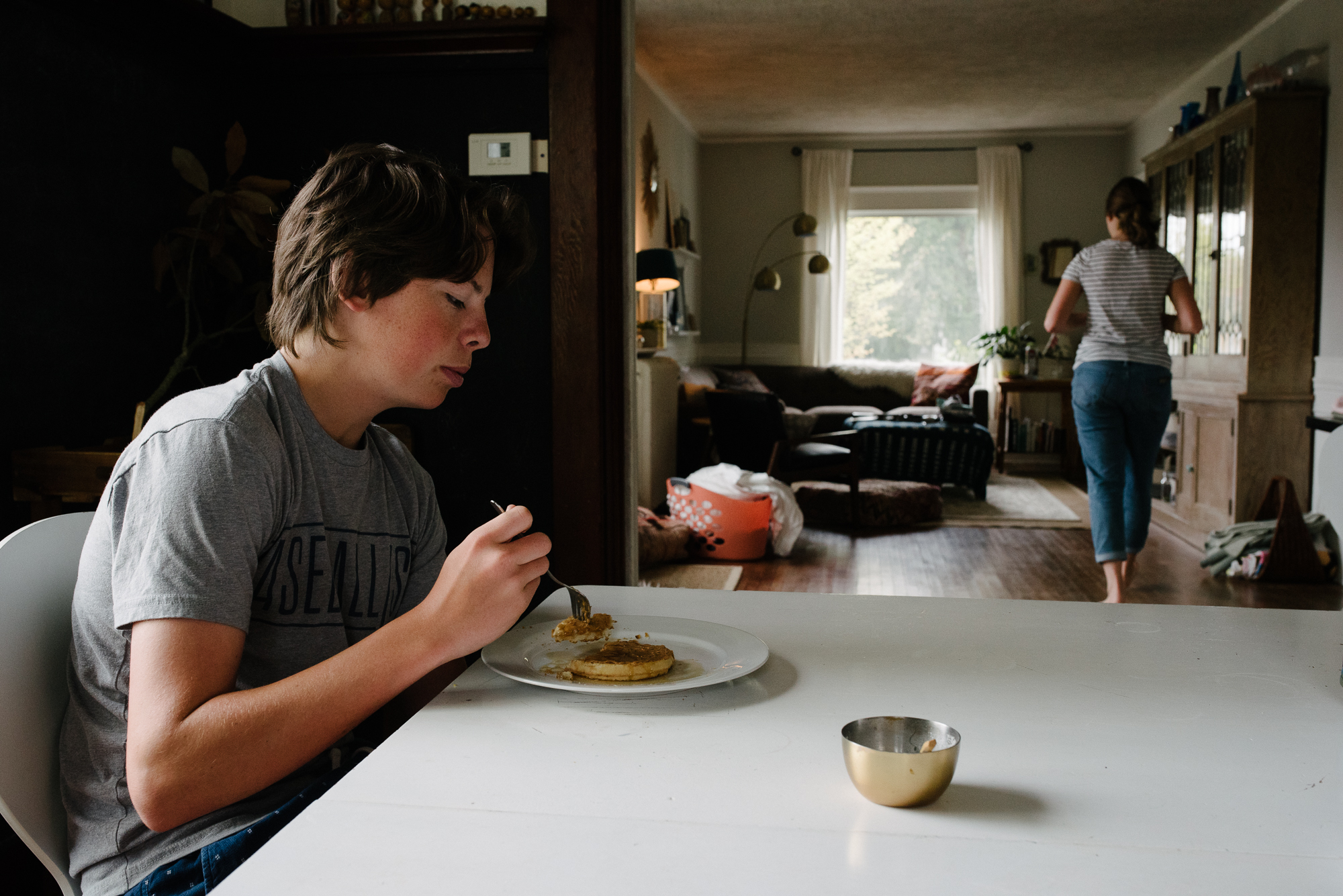 kid at breakfast table - documentary family photography