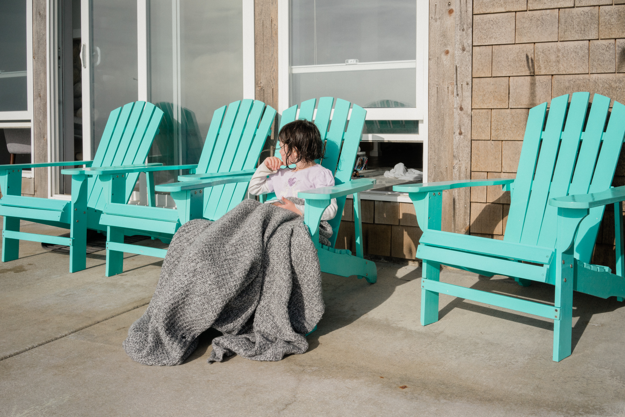 girl in Adirondack chairs - documentary family photography
