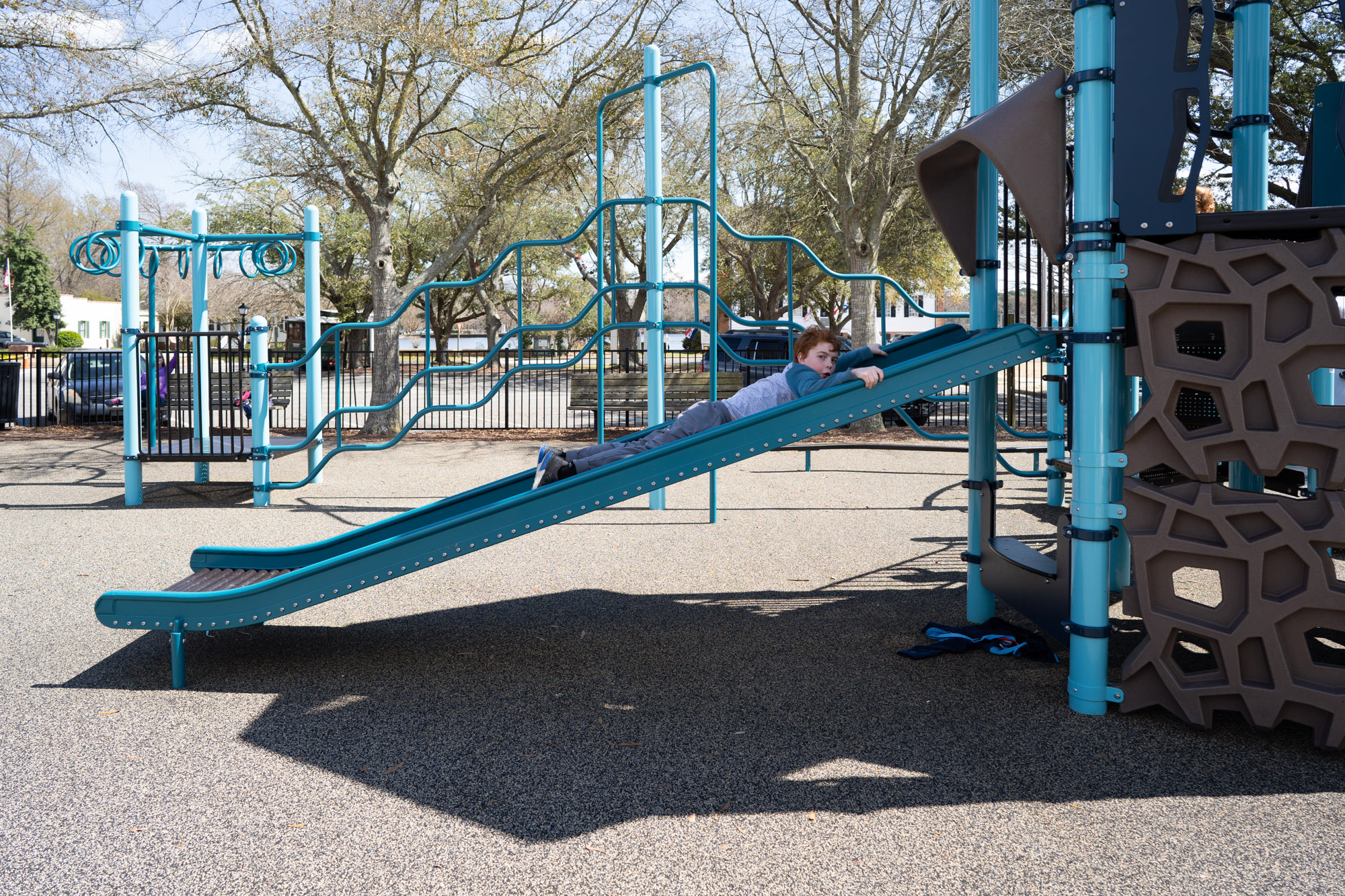 boy on slide - documentary family photography